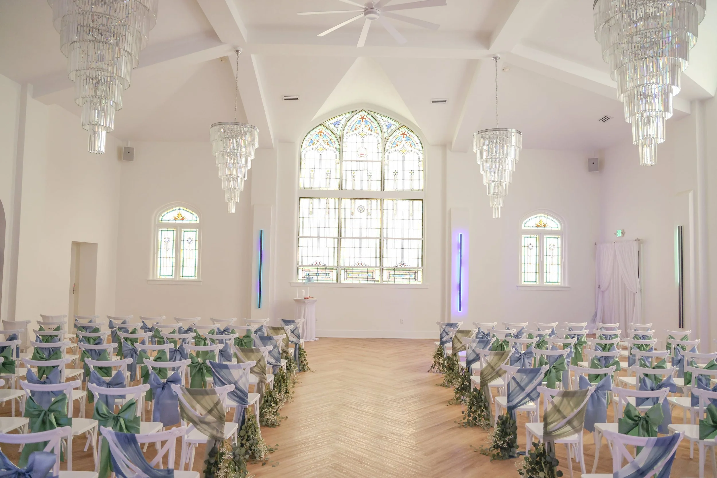 empty-ceremony-room-dusty-blue-sage-chairs.jpg