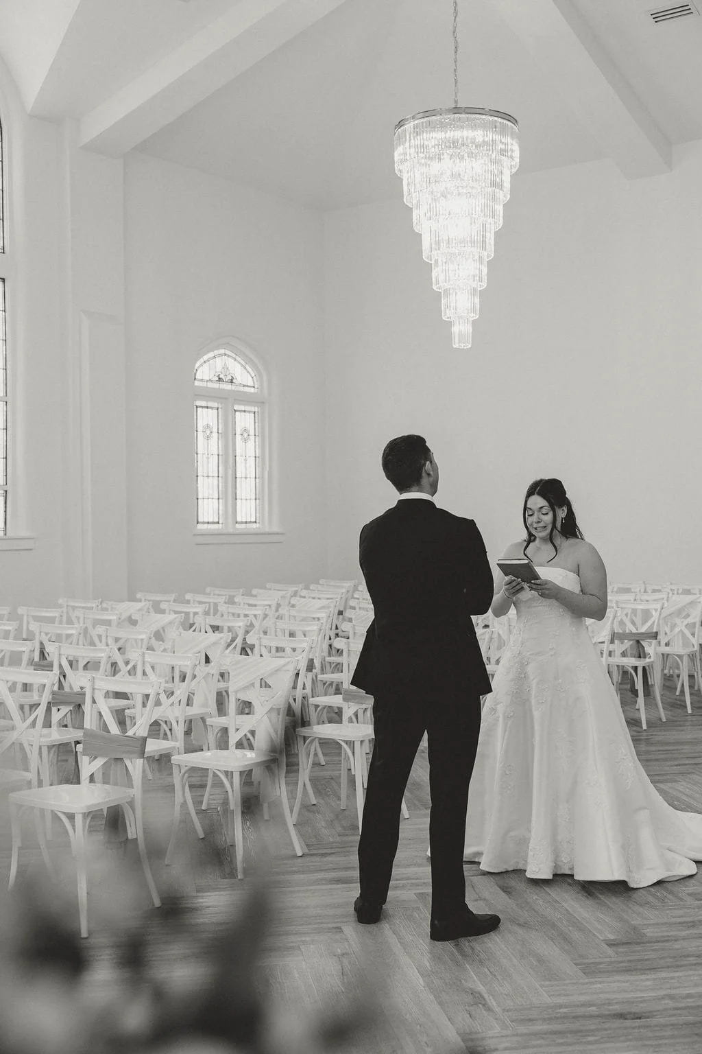 chapel-wedding-vows-crystal-chandelier-black-and-white.jpg