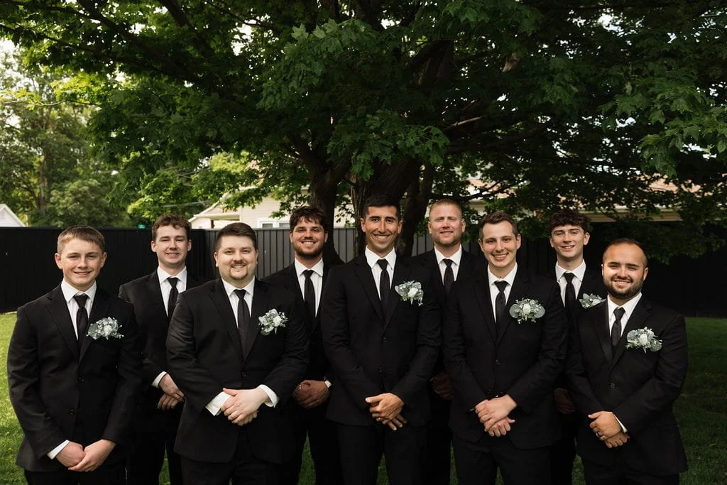 groom-groomsmen-portraits-under-tree.jpg