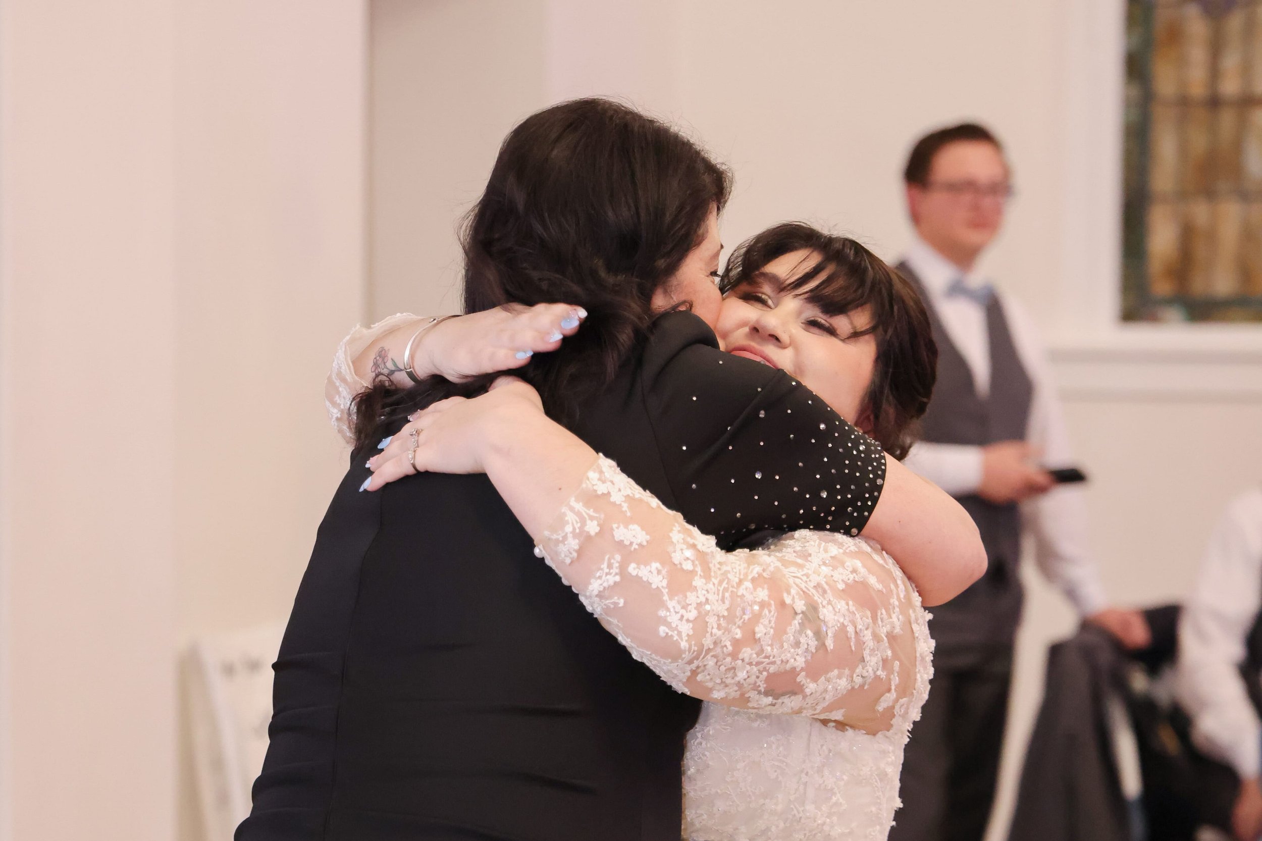 bride-embracing-guest-reception-hug.jpg