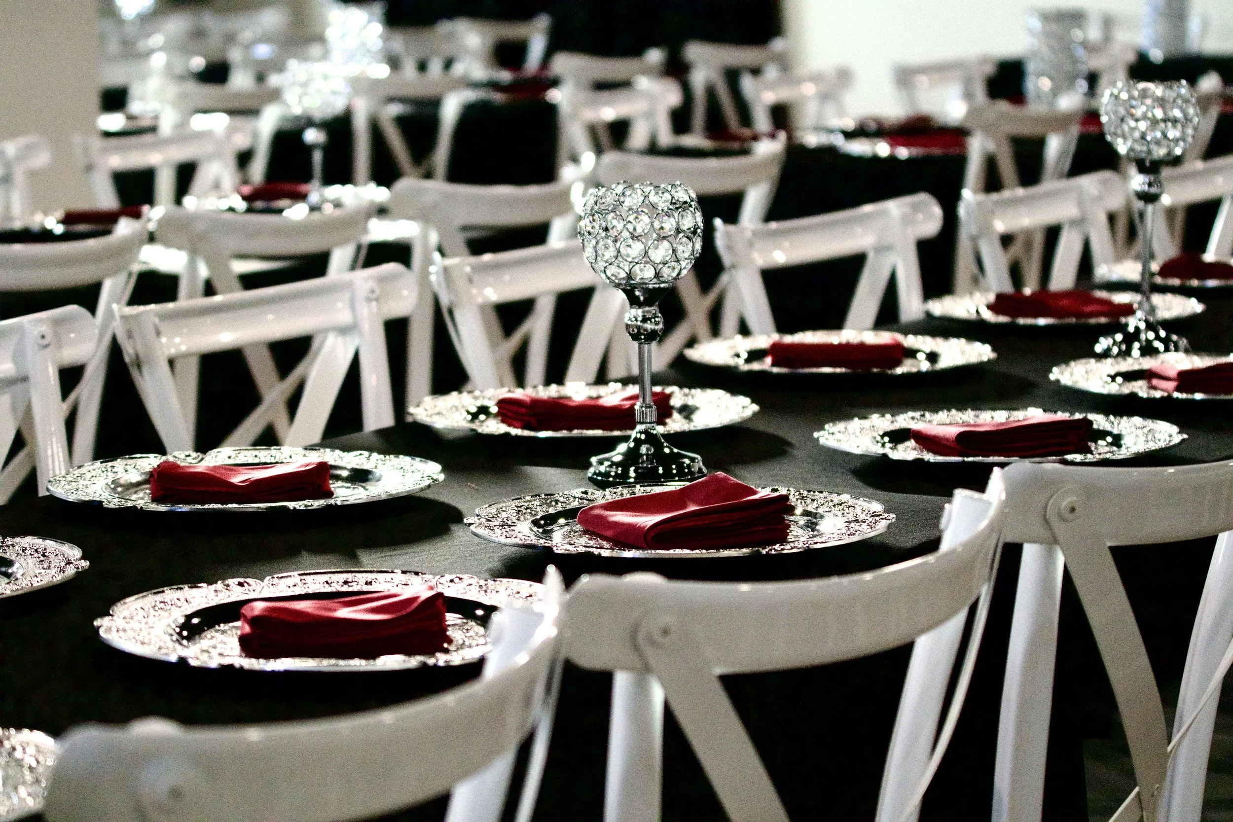 close view down a Gatsby reception table lined with crystal ball centerpieces