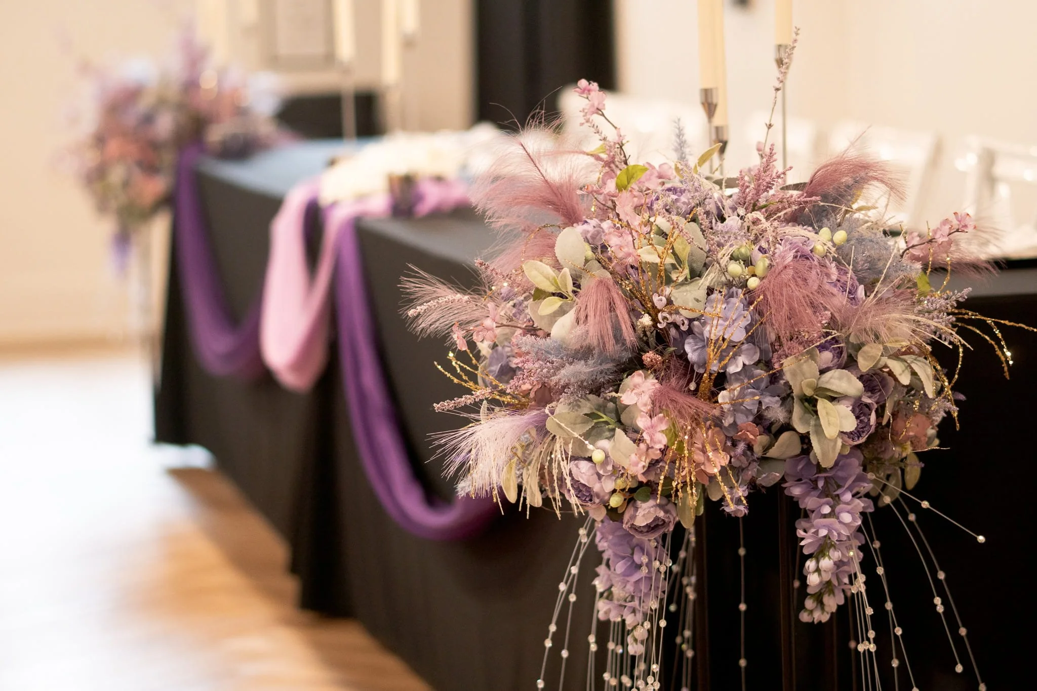 kaleidoscope-weddings-enchanted-headtable-floral-drape.jpg
