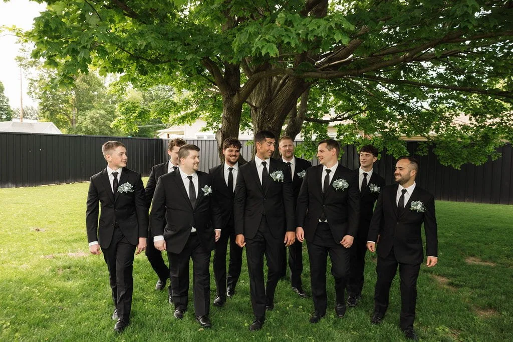 groom-groomsmen-walking-wedding-portraits.jpg