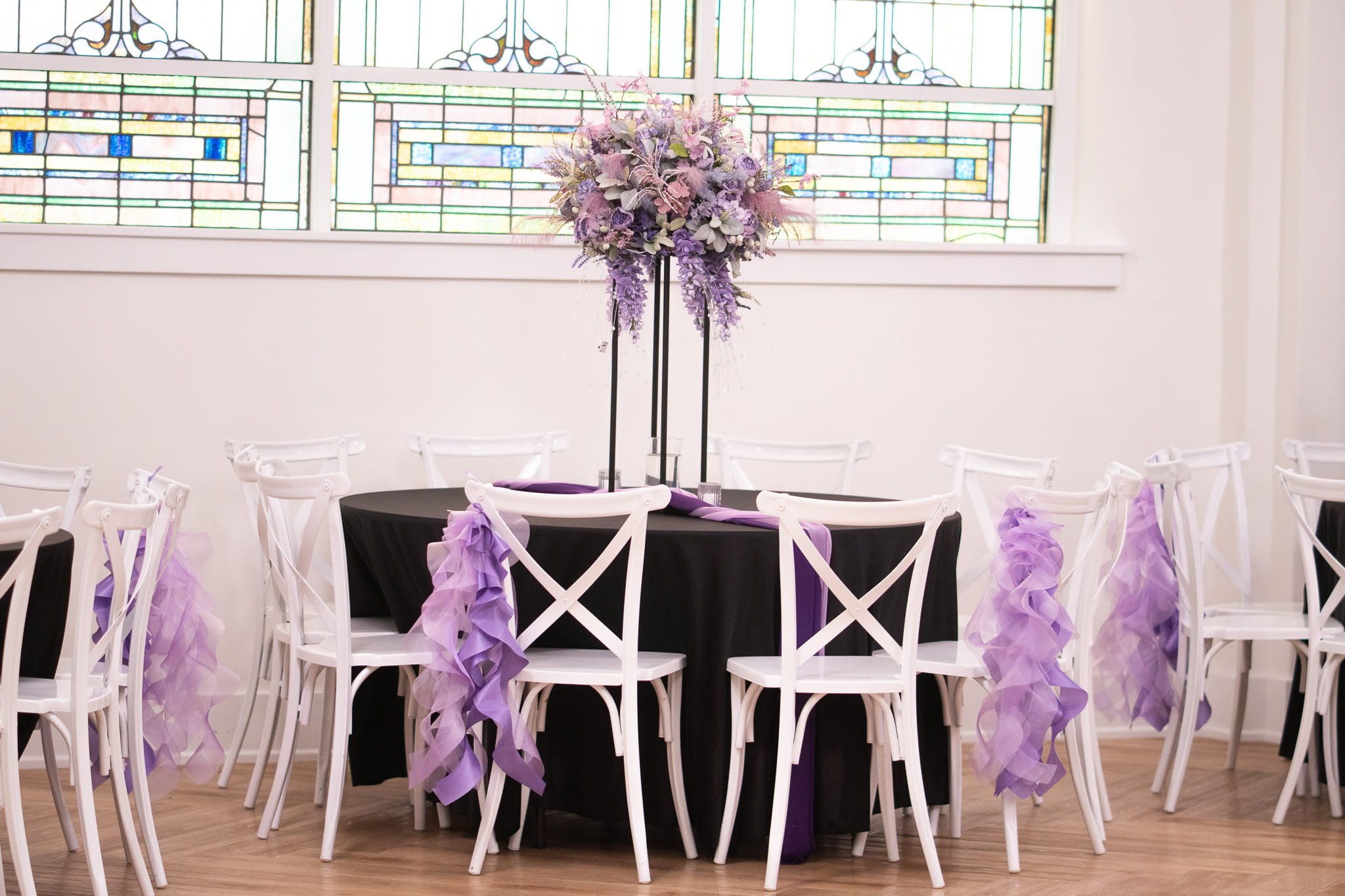 kaleidoscope-weddings-enchanted-round-table-purple-ribbons.jpg