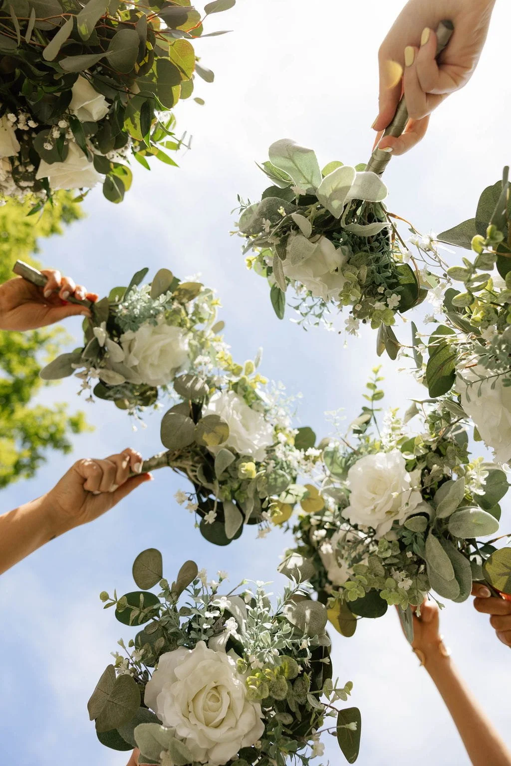 bridesmaids-white-rose-bouquets-sky.jpg