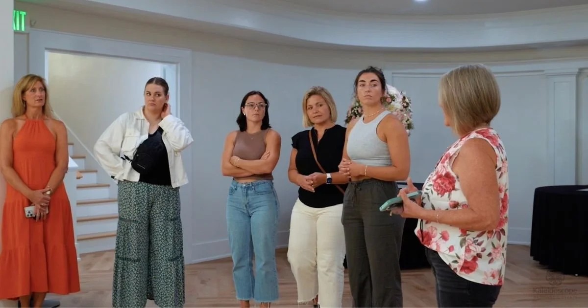 bride and bridesmaids on a private venue tour listening to a Kaleidoscope Weddings and Events coordinator