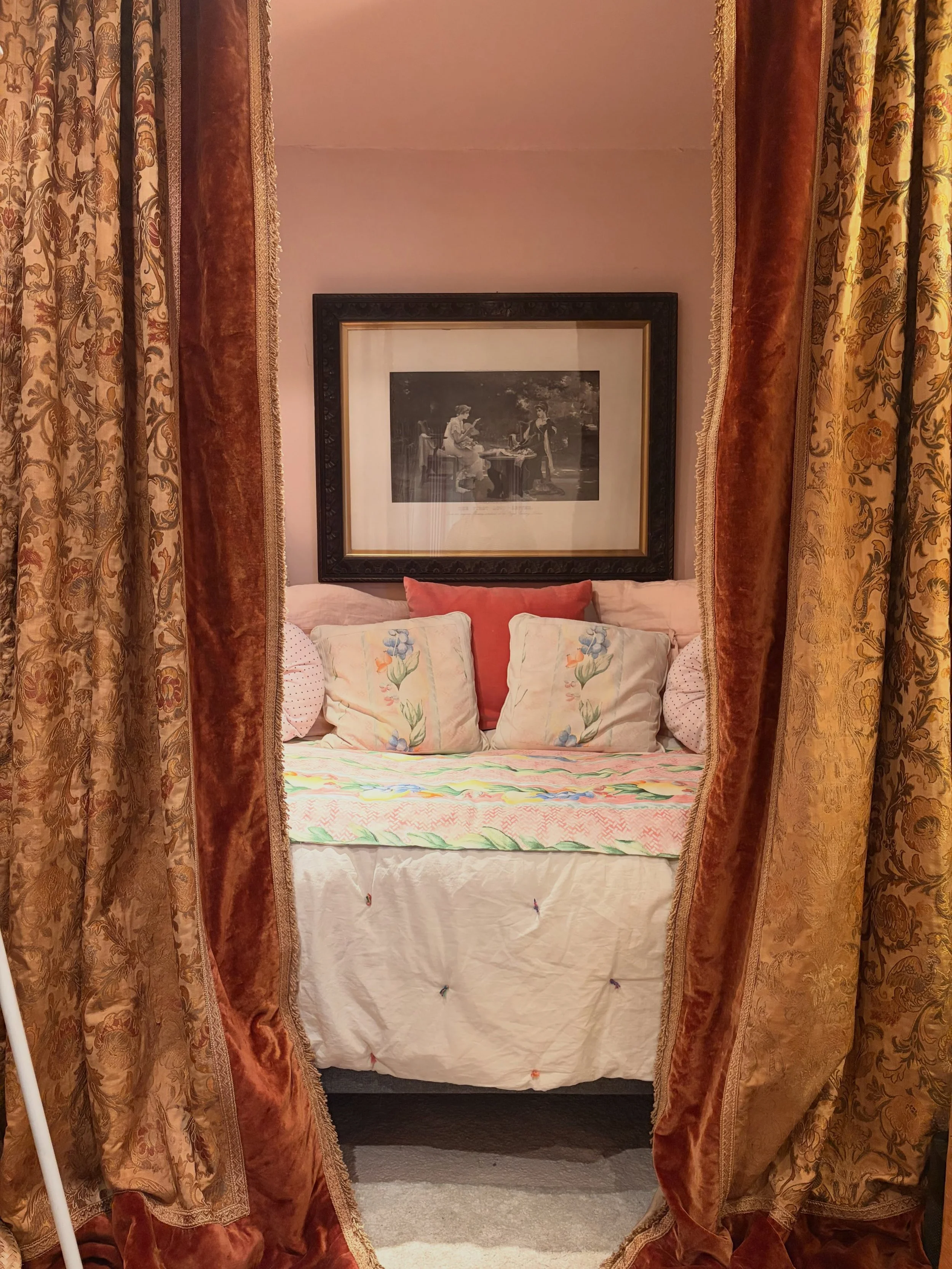 The tiniest single day bed in the studio with the heaviest, most lush 160 year-old silk velvet brocade handmade curtains from Norway hanging in front. I love the contrast. The duvet is one made of wool and unbleached cotton that I made in Denmark ear