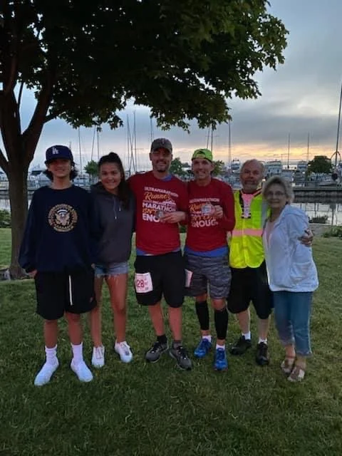 Celebrating the Lighthouse 100 Finish with whole crew