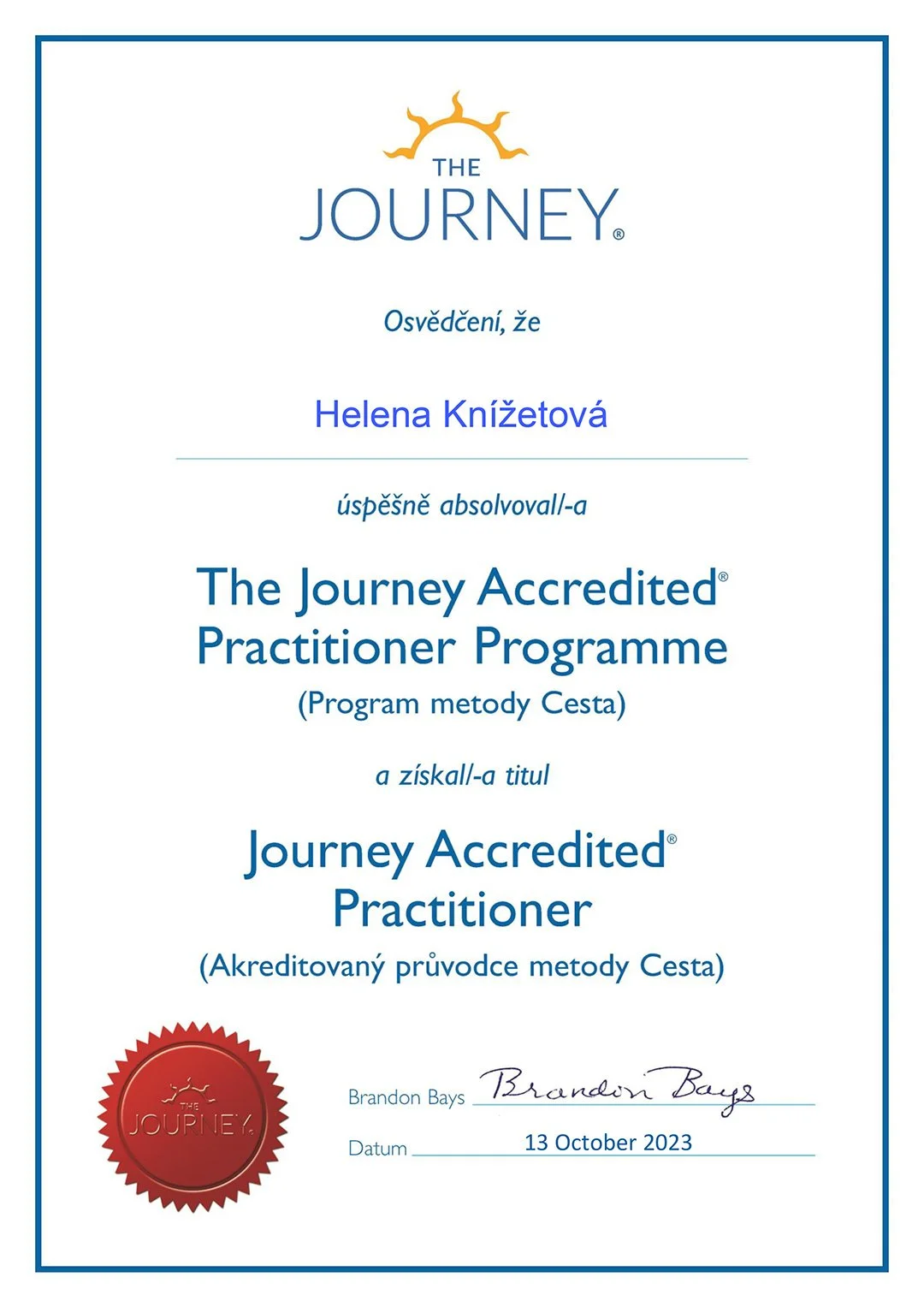 A certificate with blue border and text, awarded by The Journey organization to Helena Knížetová for completing The Journey Accredited Practitioner Programme on October 13, 2023, signed by Brandon Bays, featuring a red seal with the text 'The Journey' and a yellow sun rising logo at the top.
