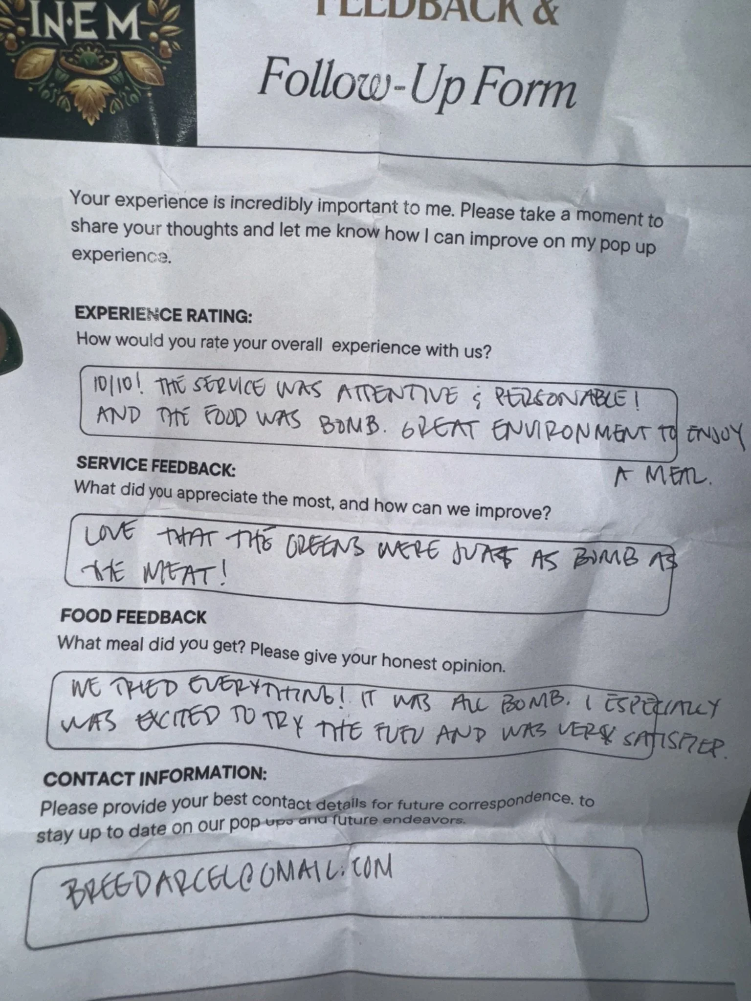A crumpled feedback and follow-up form from a restaurant or food service establishment, with handwritten responses about the experience.