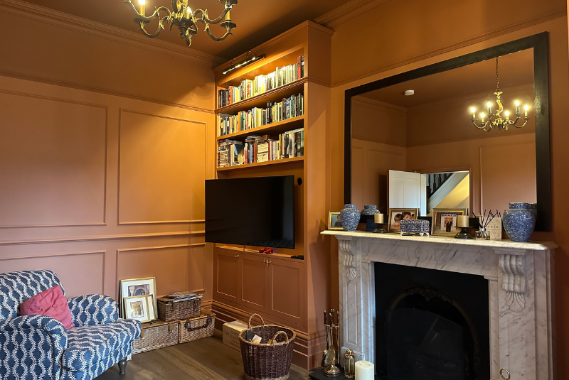 A rich terracotta paint covers the living room