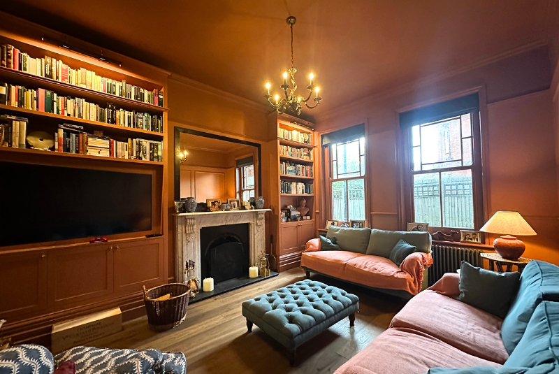 Colour-blocked terracotta tones defining the lounge space at Campion House, Meads