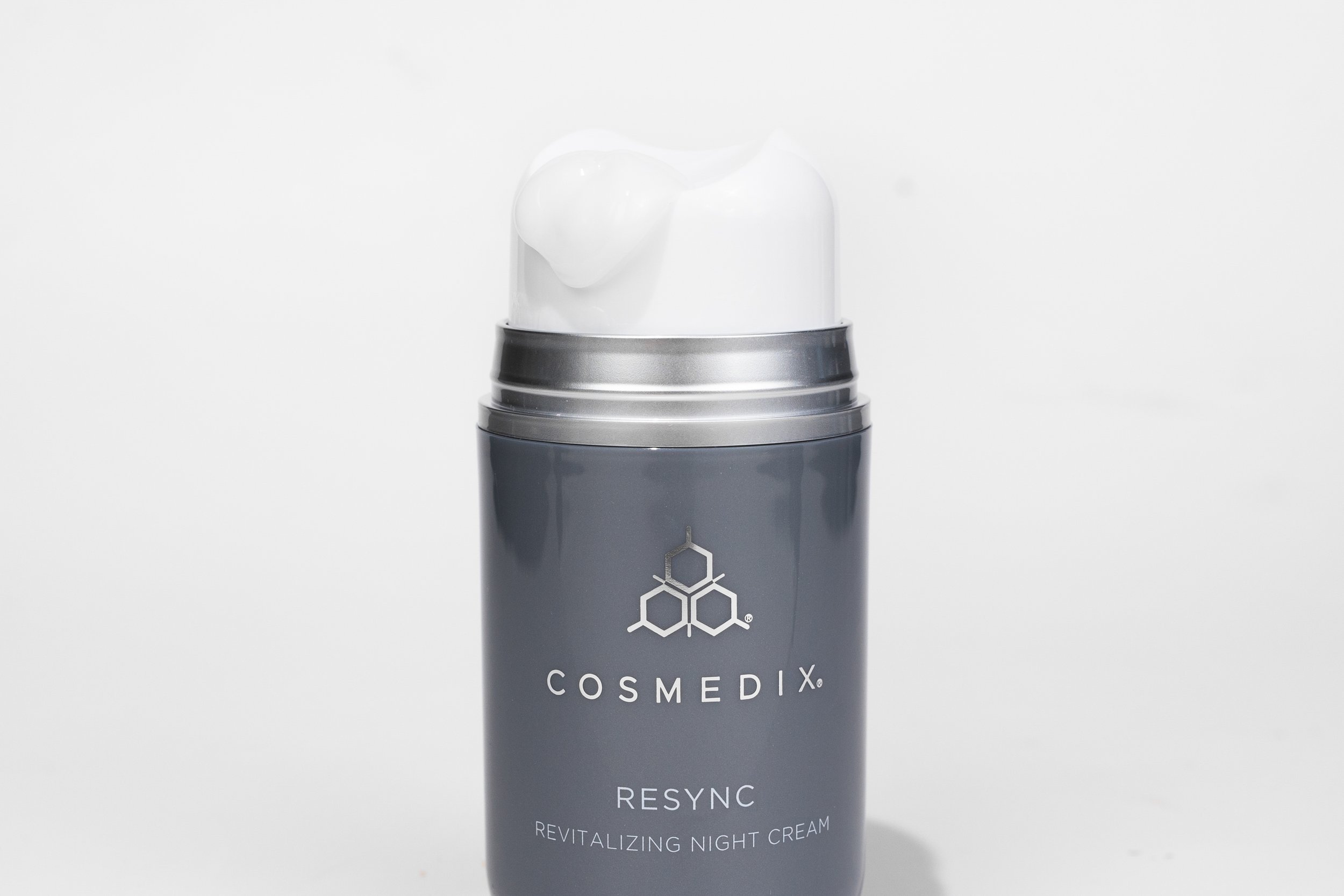 Resync Revitalizing Night Cream product bottle with white swatch on lid