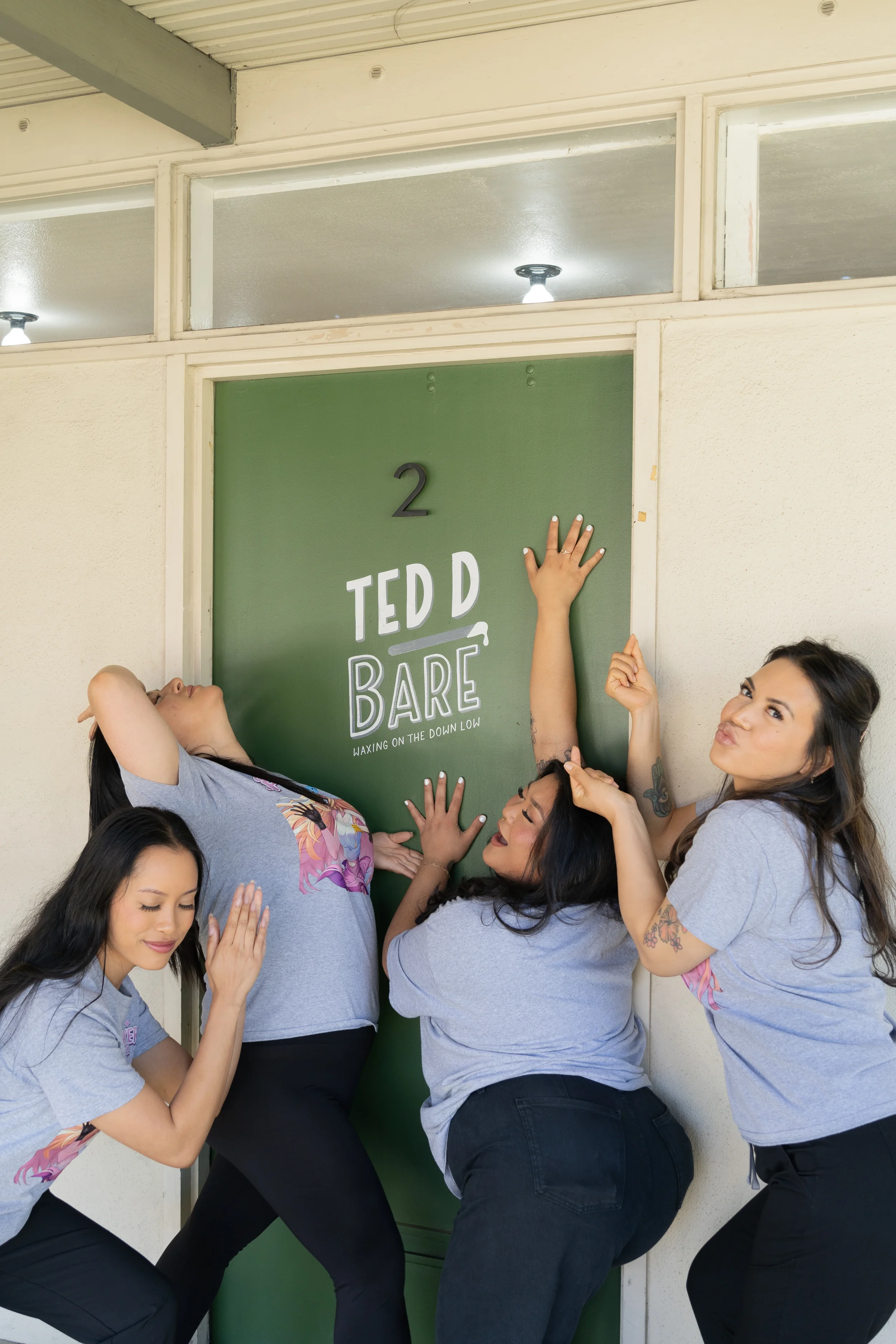 group photo of ted d bare speed waxing team at studio