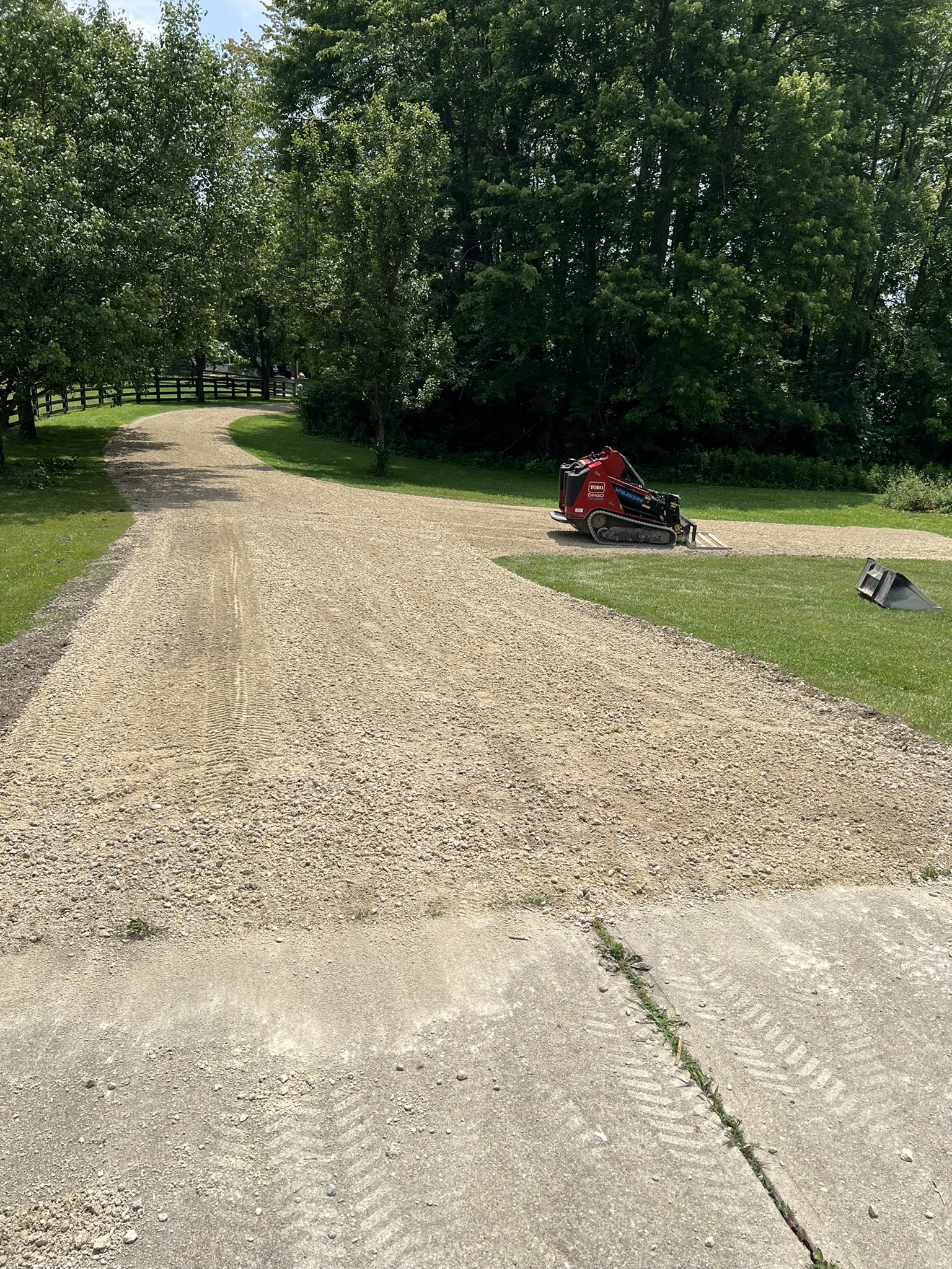 Compact equipment grading a gravel driveway in Greater Cincinnati