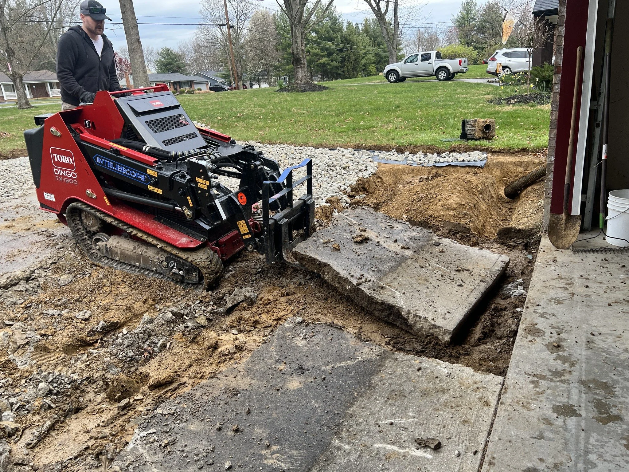 Concrete driveway removal with compact equipment in Greater Cincinnati