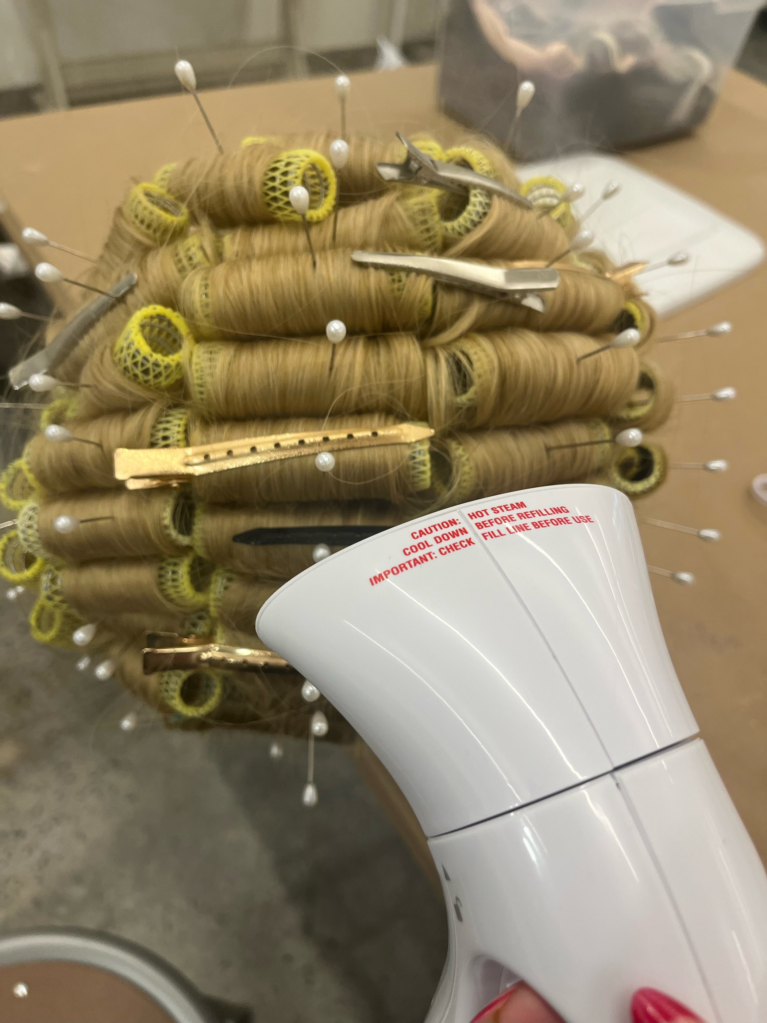 Straightened, rolled, steamed for new curl pattern
