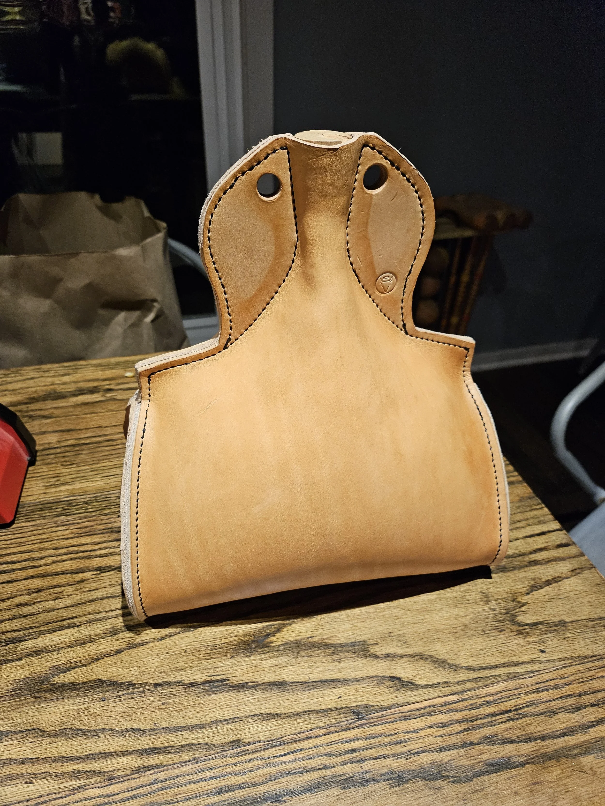 Costrel is packed tightly with corn or sand after wetting. This stretches the leather and brings it to its final shape
