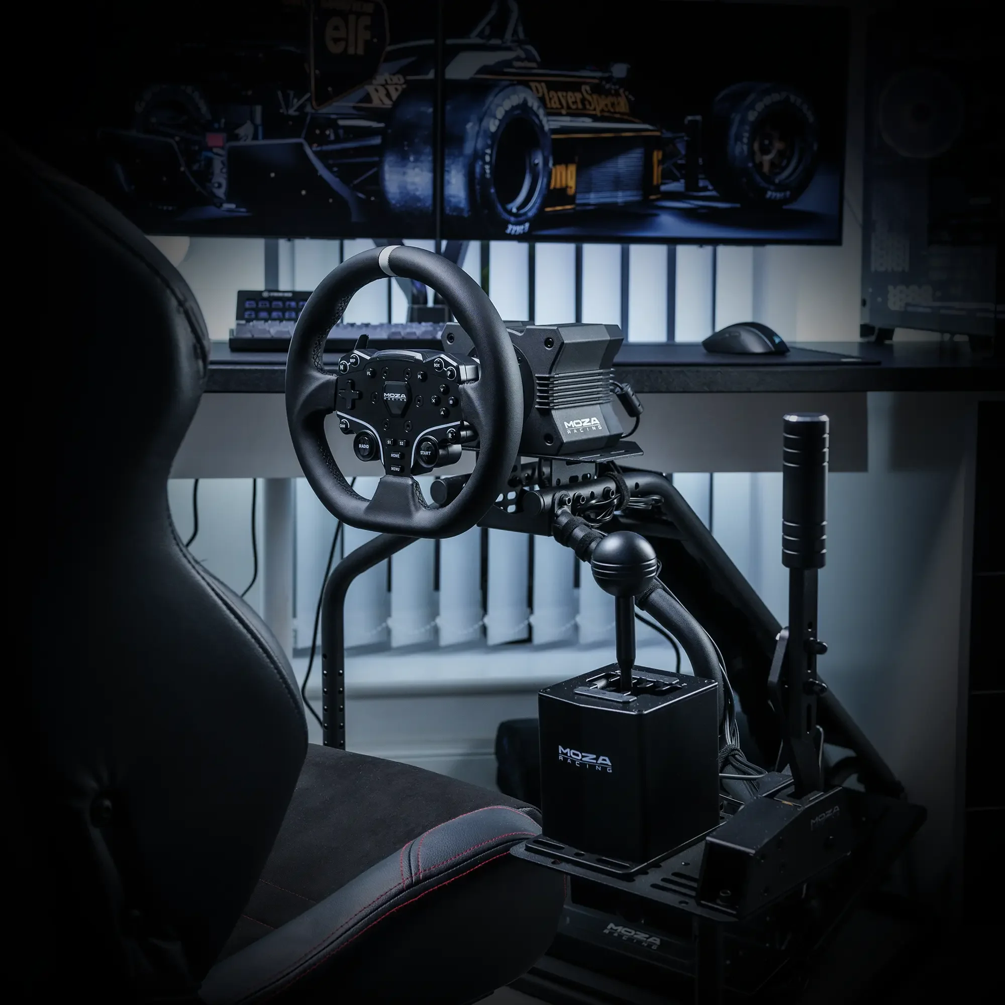 Sim racing setup featuring a racing seat, steering wheel, gear shifter, and pedals, with monitors displaying a racing game in the background.