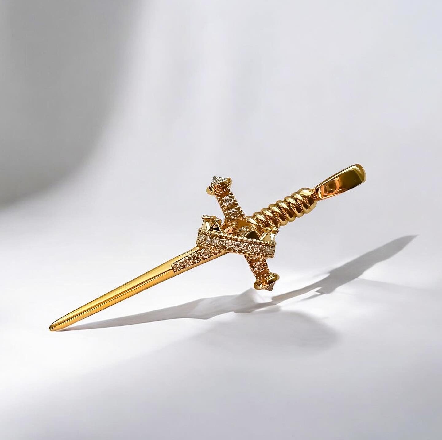 14k gold sword and crown set with lab created diamonds.