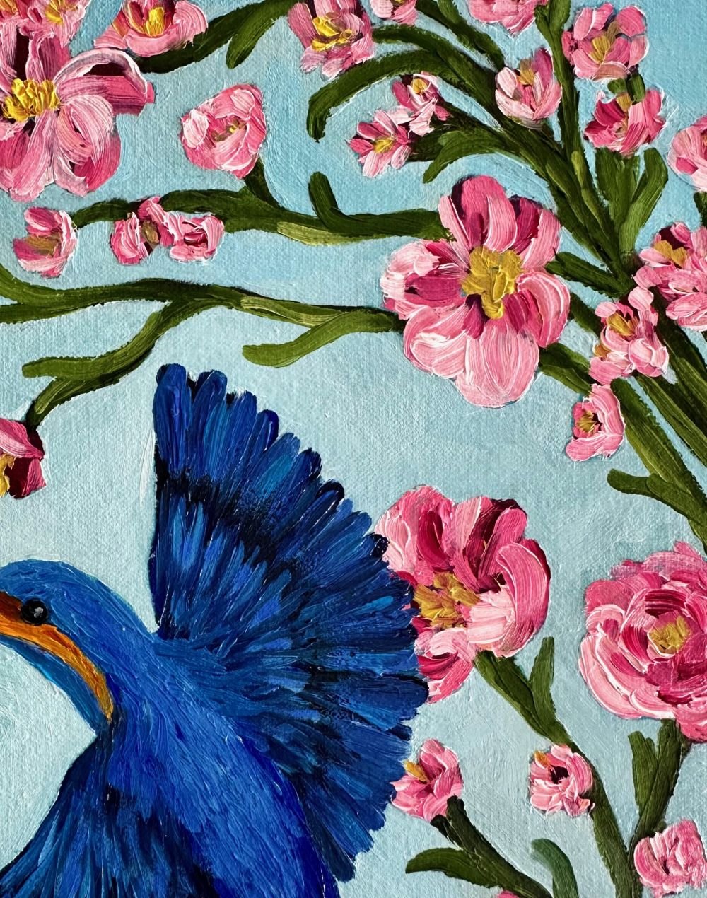 Kingfishers in Flight is an original oil painting by Australian artist Cassie Holmes, and features three beautiful kingfisher birds flying amongst some beautiful soft pink flowers.