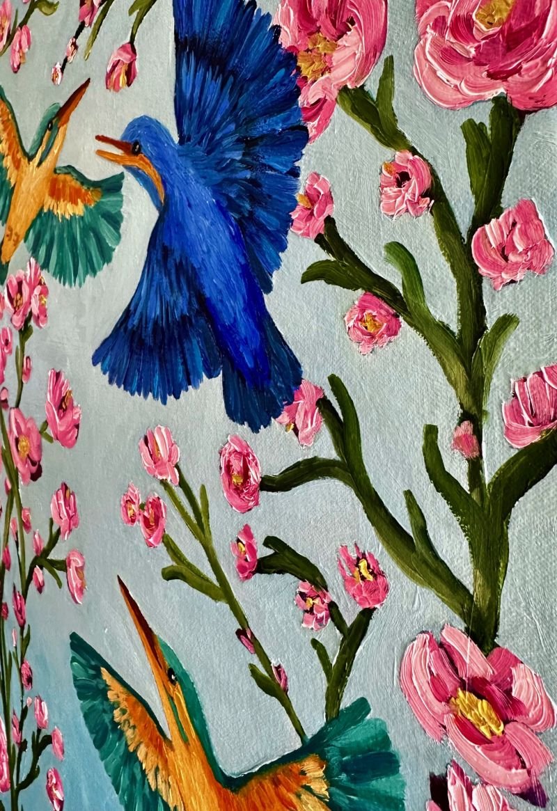 Kingfishers in Flight is an original oil painting by Australian artist Cassie Holmes, and features three beautiful kingfisher birds flying amongst some beautiful soft pink flowers.
