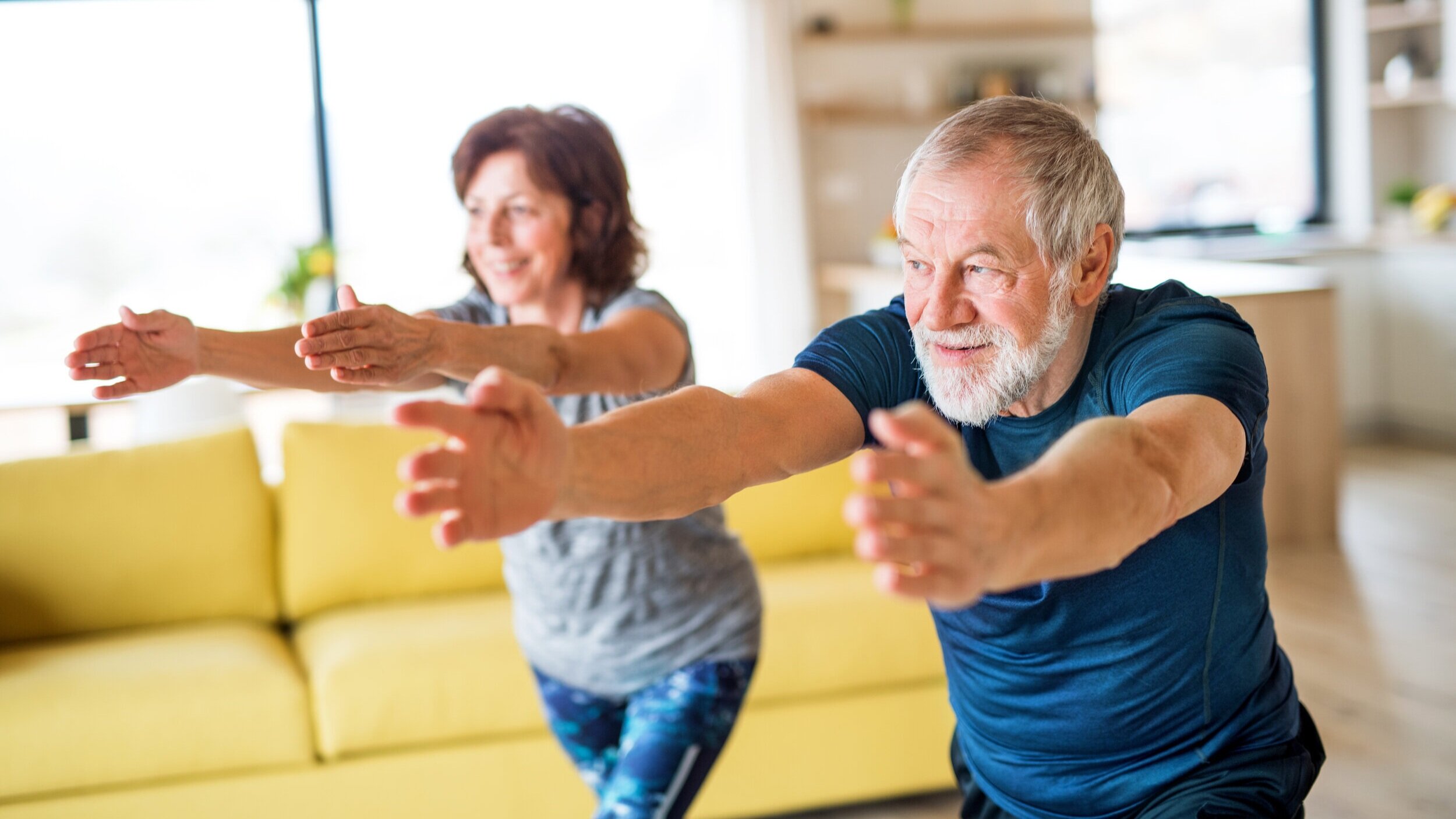 p_A-senior-couple-indoors-at-home%2C-doing-exercise-indoors.-1173306413_5568x3712.jpg