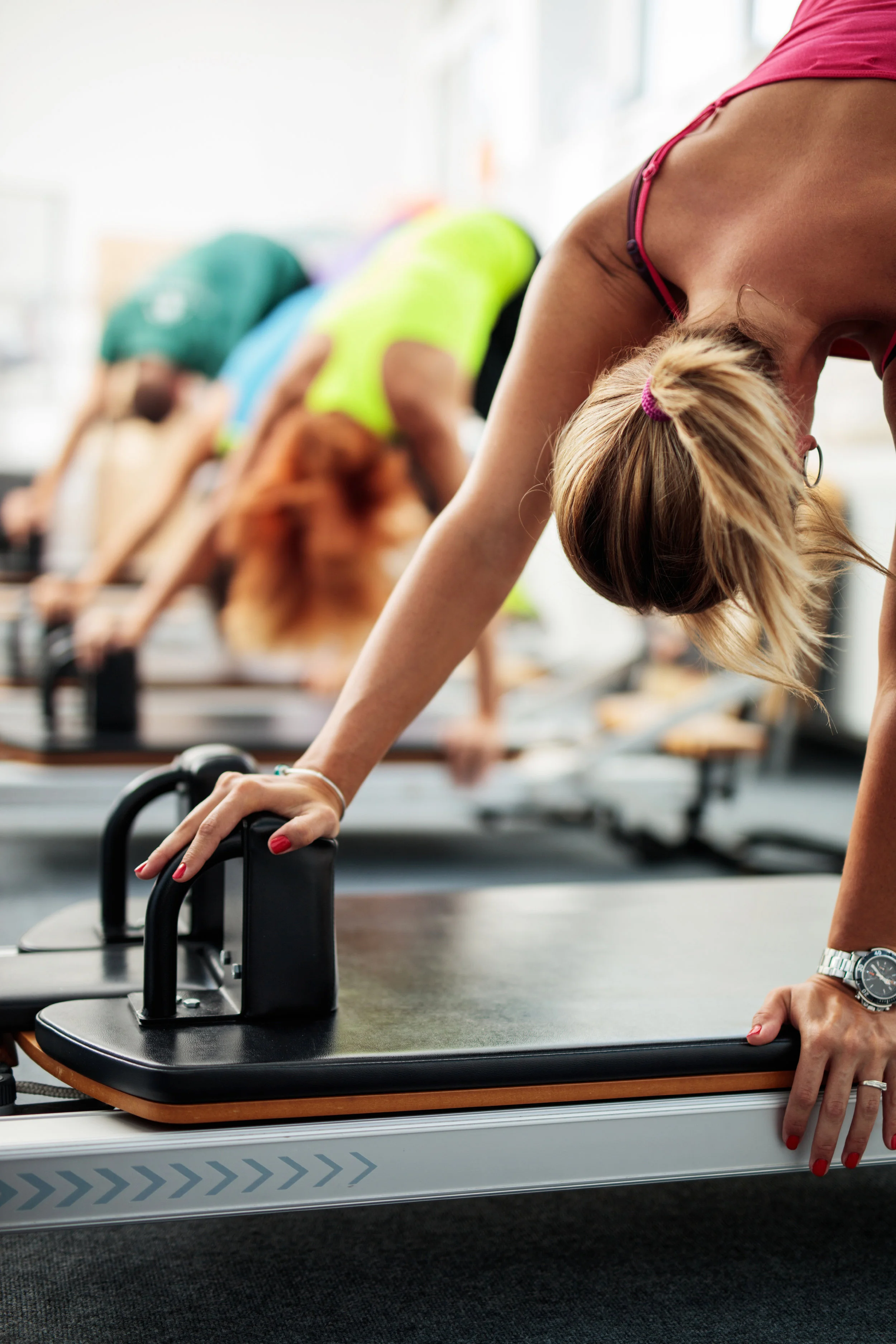 Group-of-people-having-a-Pilates-class-on-exercise-machines.-495505980_2579x3869.jpeg