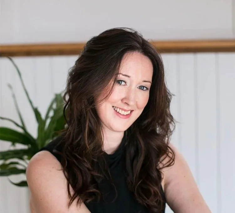 Caitlin Bovee smiling at her 26 Eramosa Studio