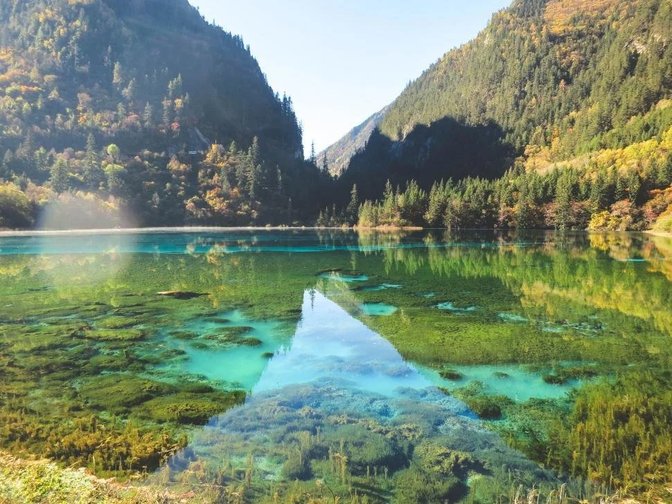 crystal-clear-lake-surrounded-by-verdant-mountains.jpg