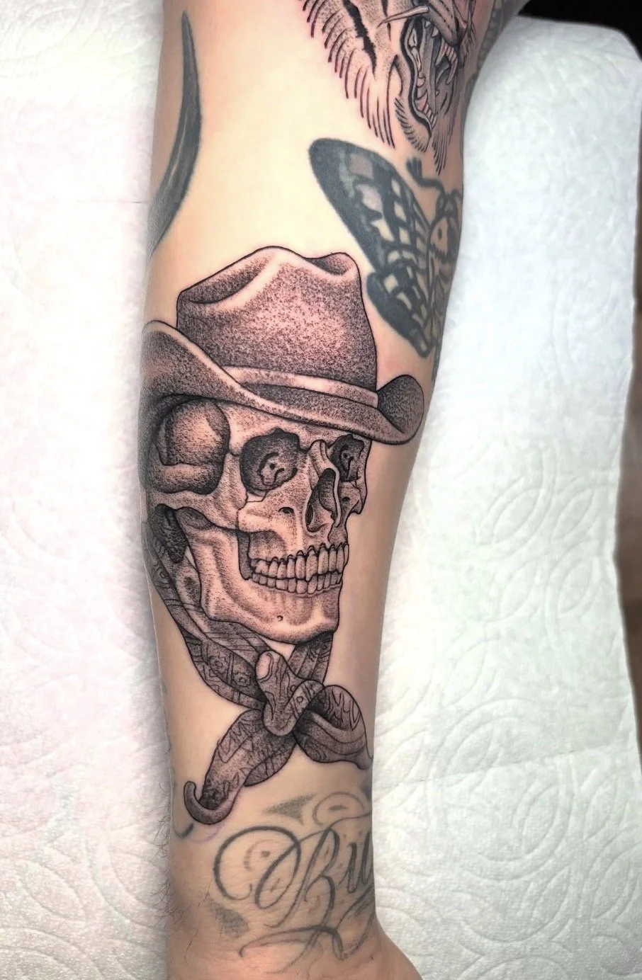 Iconic Tony Polito skull redrawn and tattooed by Daniel Collins at Rose Tattoo in Point Loma San Diego in California. Realism style tattoo with high detail, clean linework, and vintage flash design influence of cowboy and western
