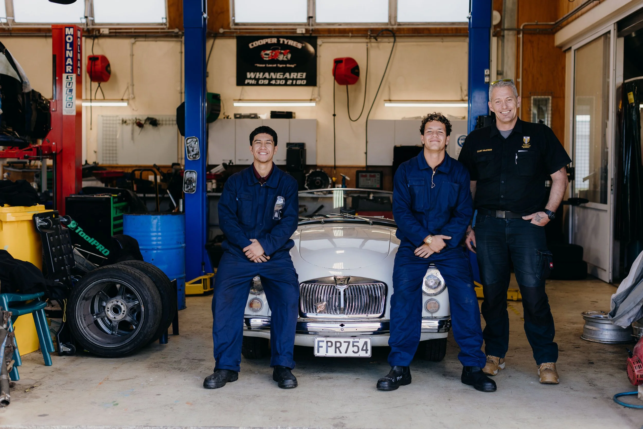 In the workshop —The 1961 MGA Mark I and students from Tikipunga High School’s Automotive Trades Academy