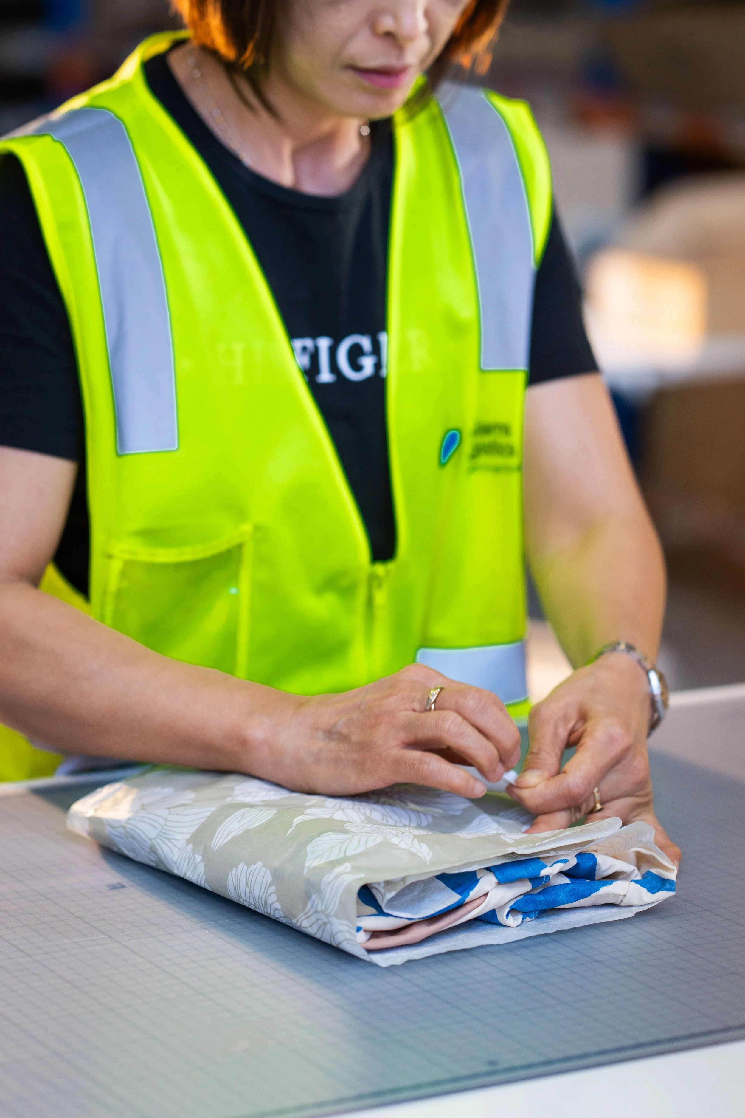 folding garments in tissue wrapping for fashion brands at our sydney 3PL location