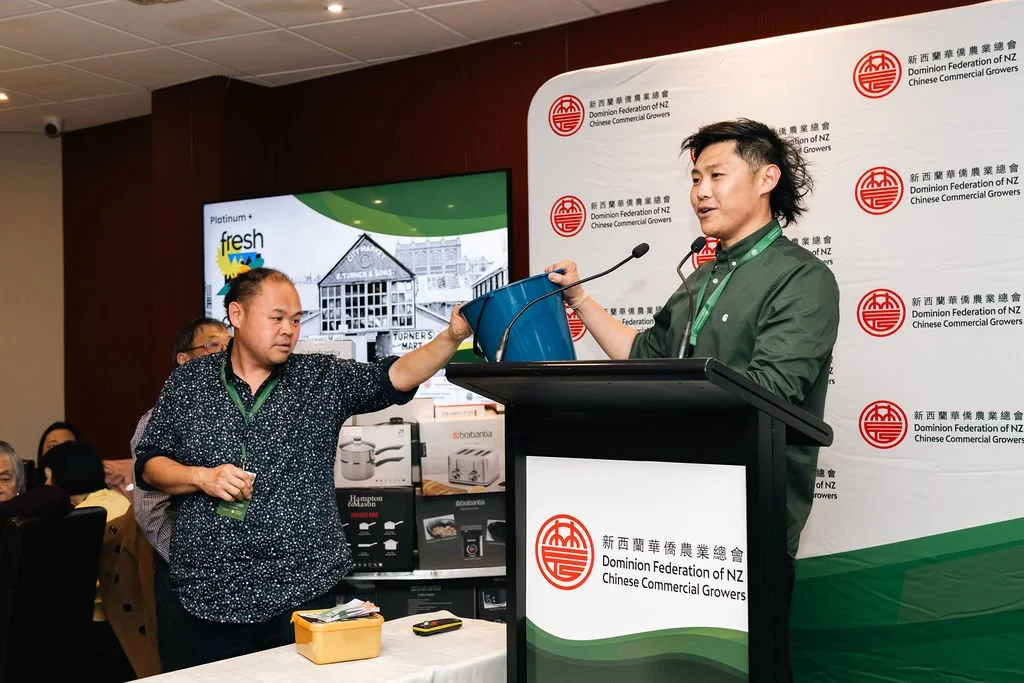 Scott and Myles Fong giving away gifts