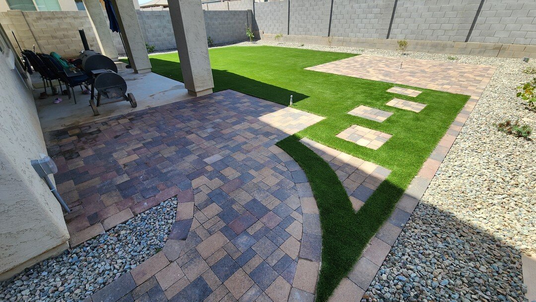 Blank lot installation including, turf, pavers, irrigation, and planting. A nice thing to note with the artificial turf here is being able to have the curved edges without needing to worry about how to water it without overspray like traditional gras