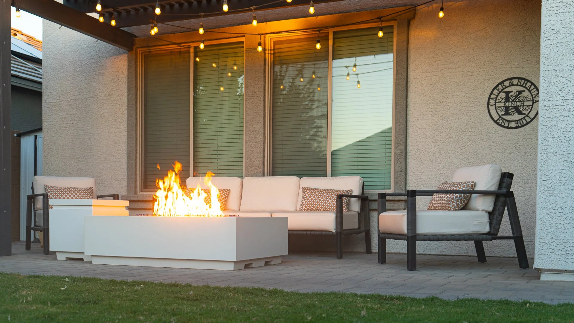 Bermuda TifTuf Sod, Belgard Rio Pavers, High Pressure Mist, PVC Drip Irrigation, Sprinklers, Apache Brown Gravel, Low Voltage Lighting, Fire Table