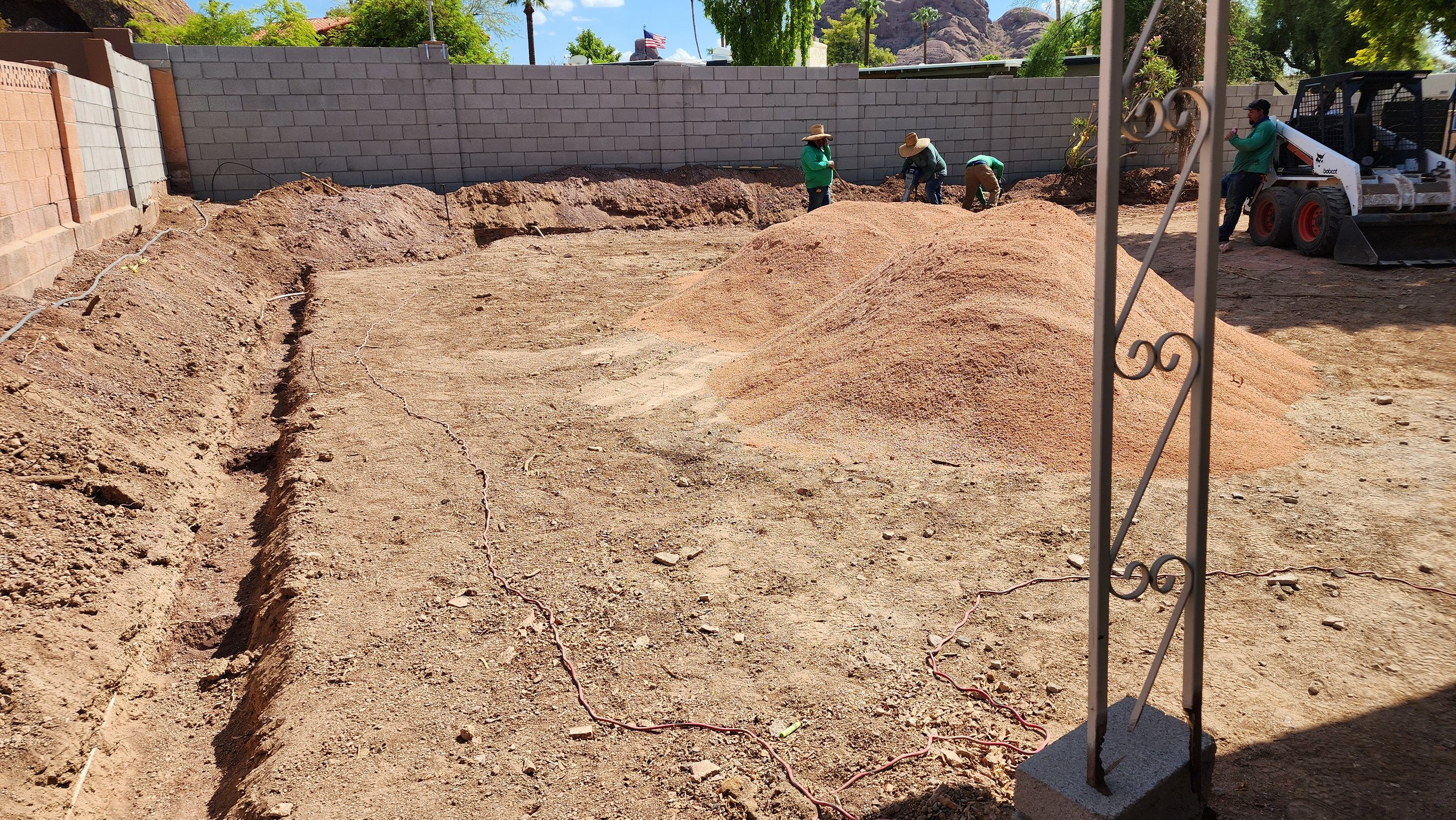 Backyard retaining wall footers being prepared for new planter in Scottsdale Arizona