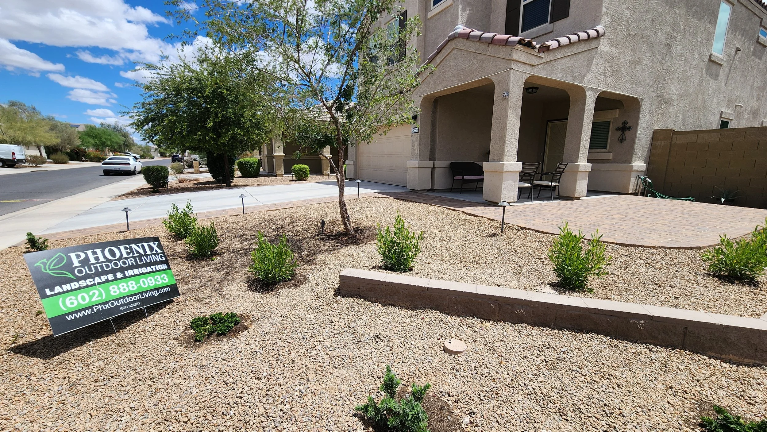 Front yard remodel in Buckeye, AZ with new Sch 40 PVC drip irrigation, 5 gal plants, Paver porch, walkway, and driveway extensions