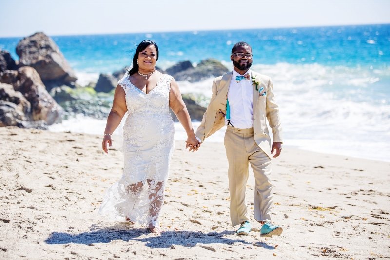 bride-and-groom-walk-on-the-beach.jpg