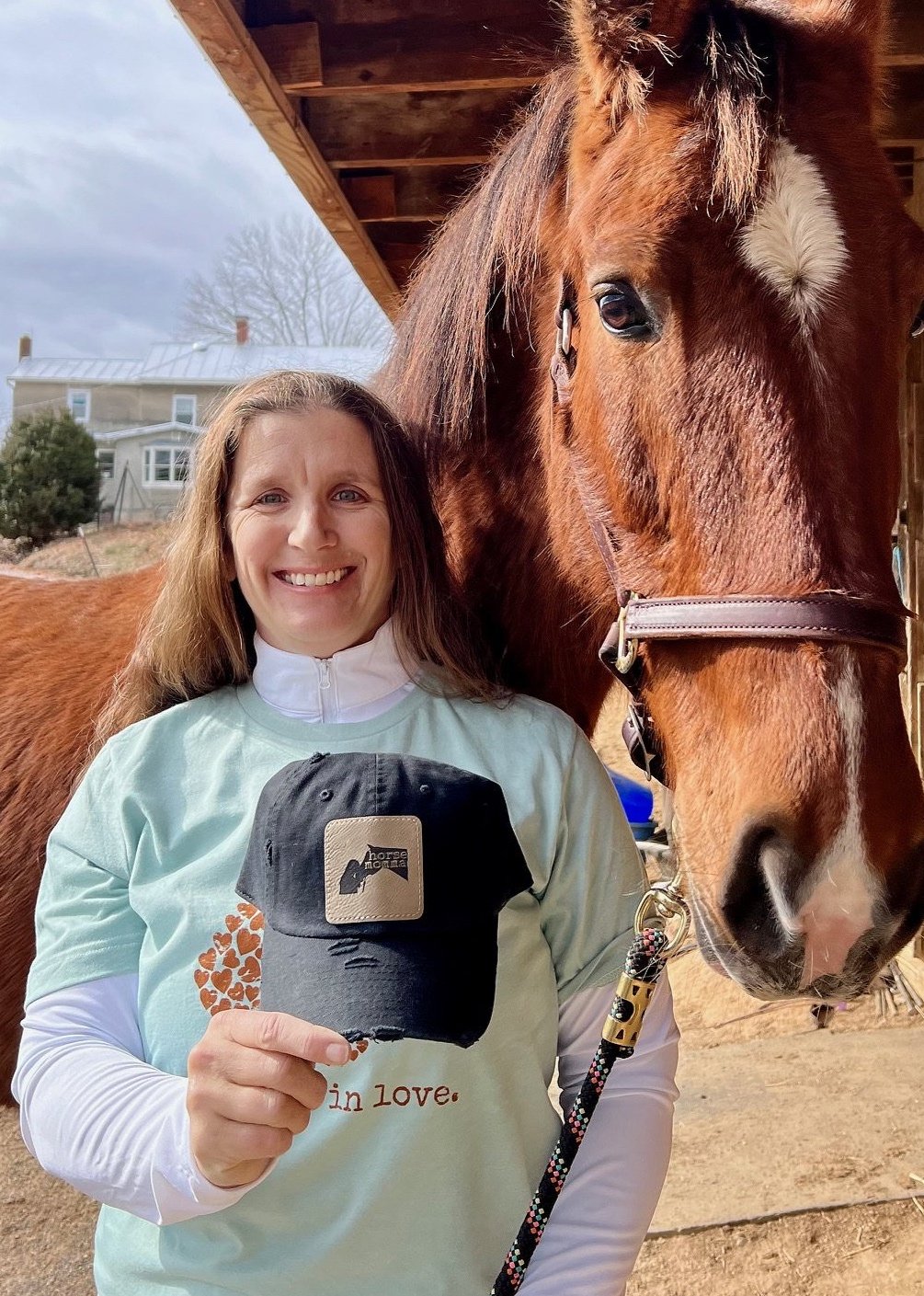 Rein+in+love+holding+horse+momma+hat.jpg