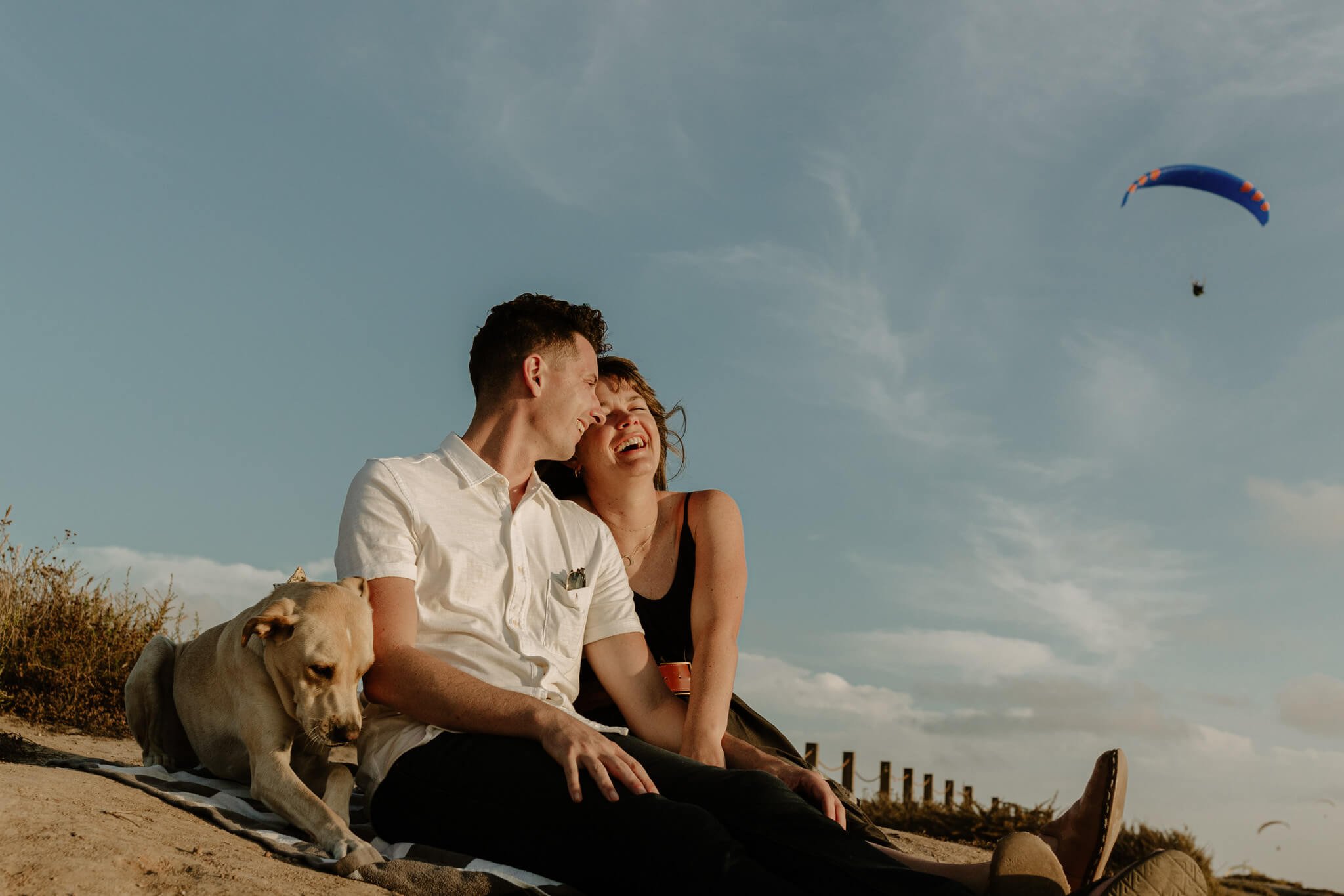 Couple-Lauhing-during-Engagement- Picnic