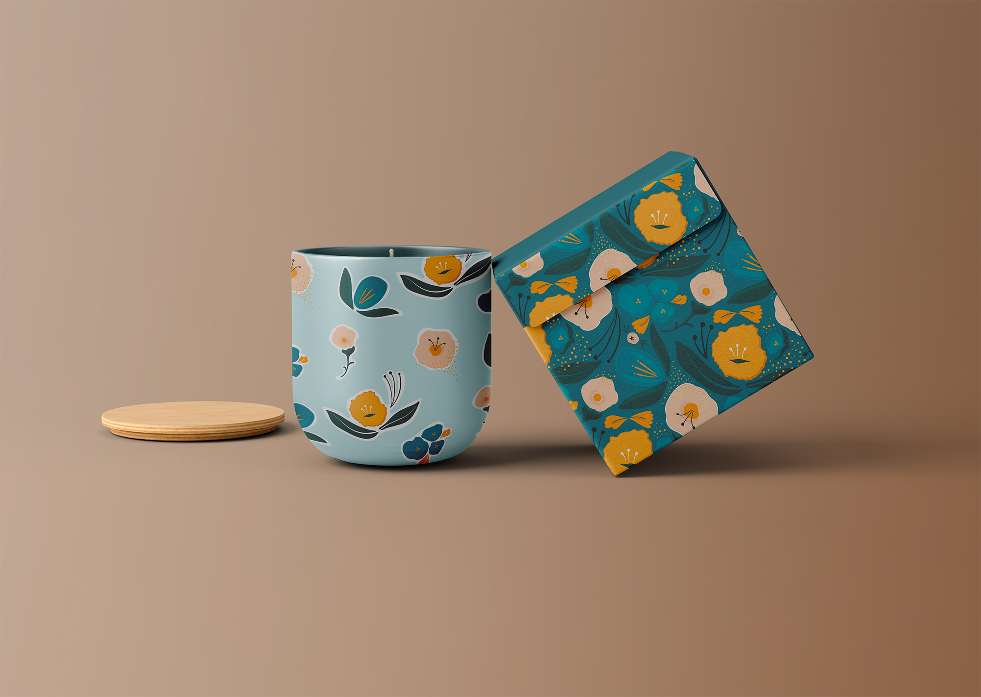 A ceramic mug with a floral pattern next to a matching box, and a small round wooden coaster.