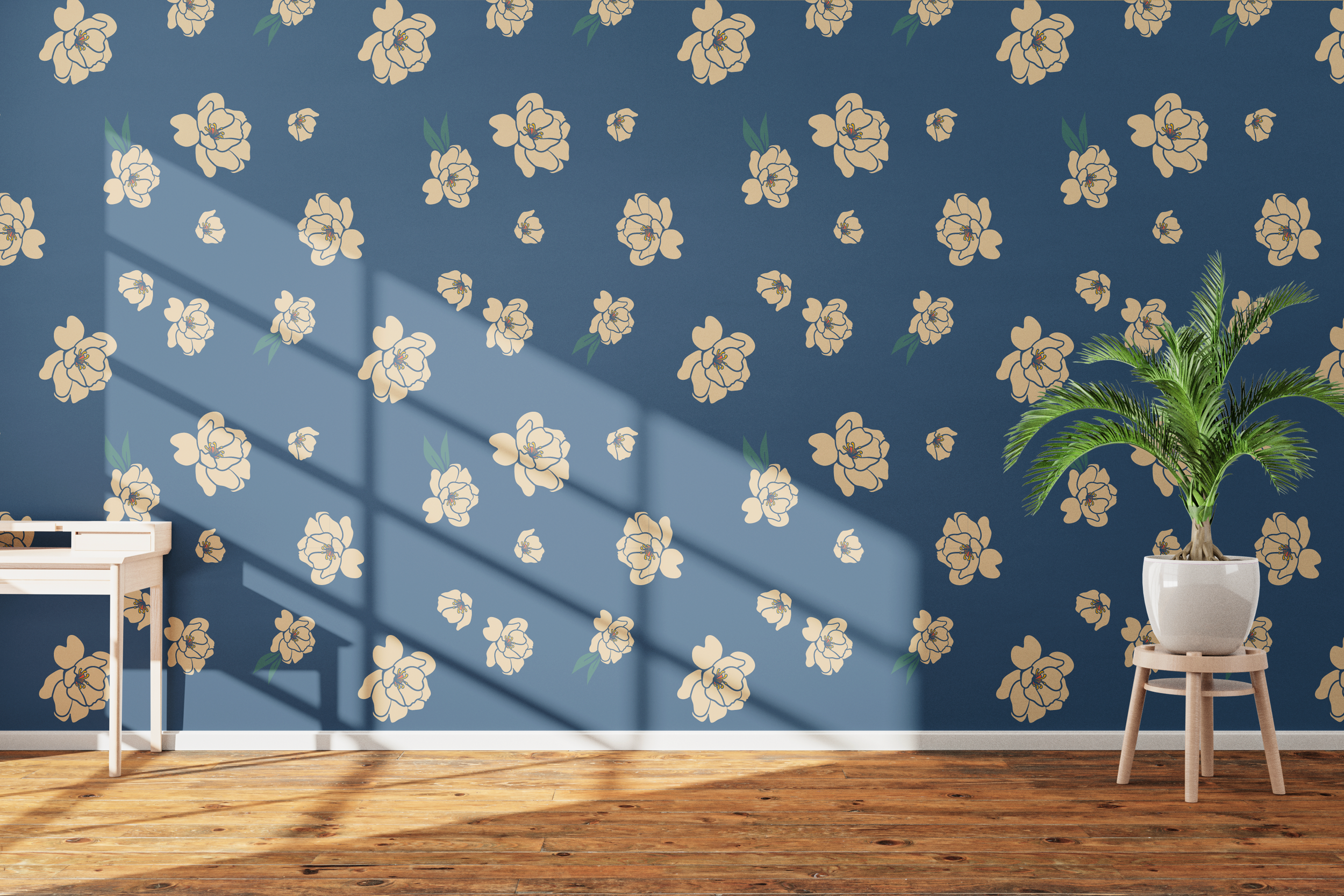 Interior view of a room with blue floral wallpaper, a white desk, and a white pot with a green potted palm plant. Sunlight creates shadows on the wallpaper and floor.