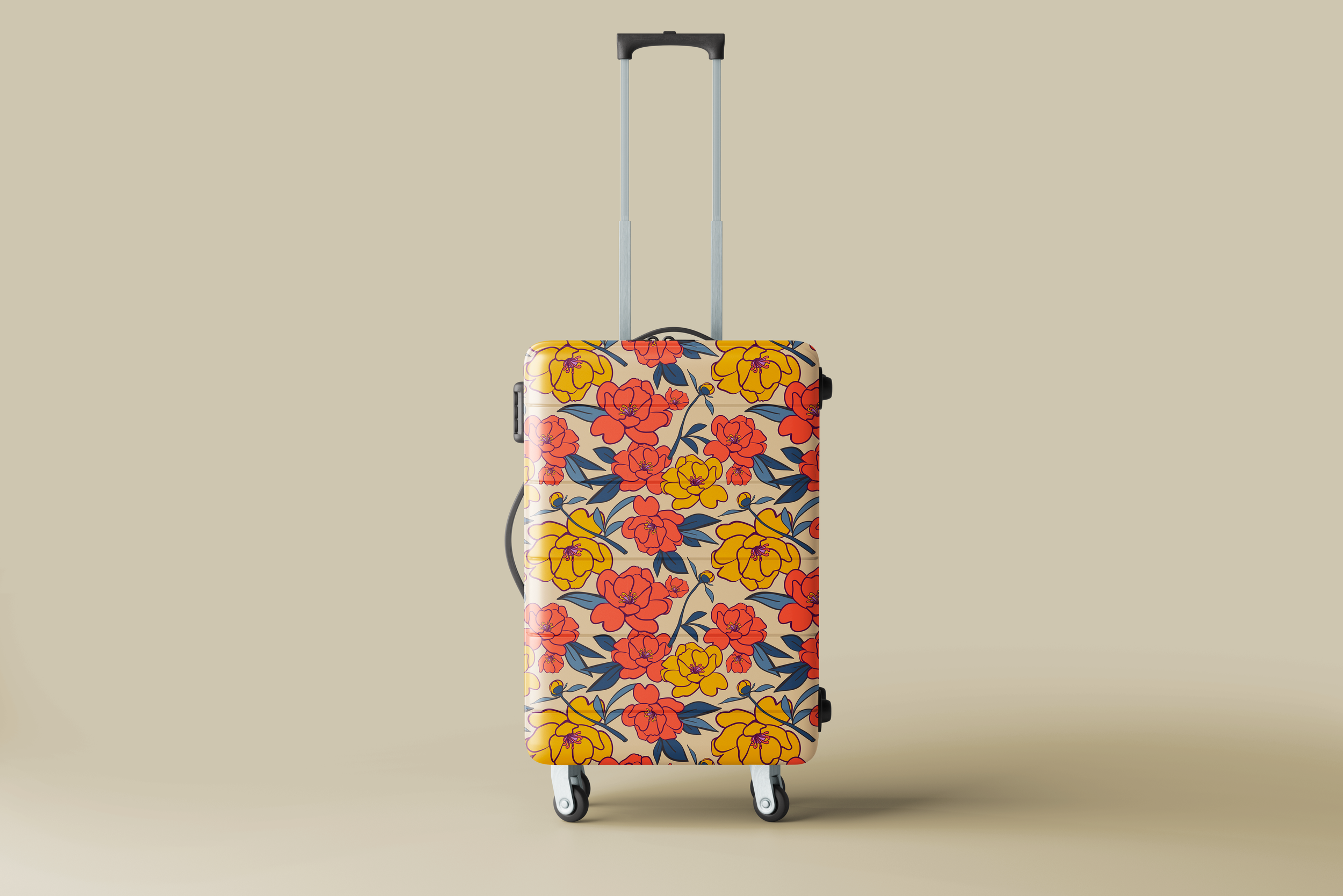 A small rolling suitcase with a floral pattern of orange and yellow flowers and blue leaves, standing upright against a plain beige background.