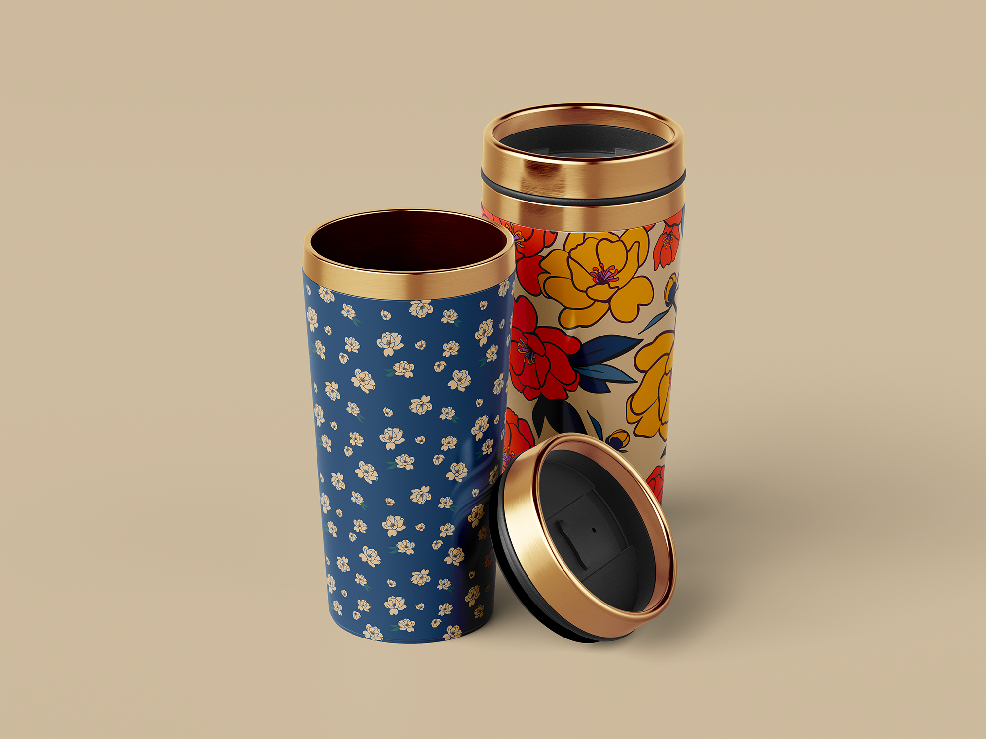 Two floral insulated tumblers with removable black lids and gold-colored rims, one with a blue background and small white flowers, the other with a cream background and large red, yellow, and blue flowers, placed against a beige background.