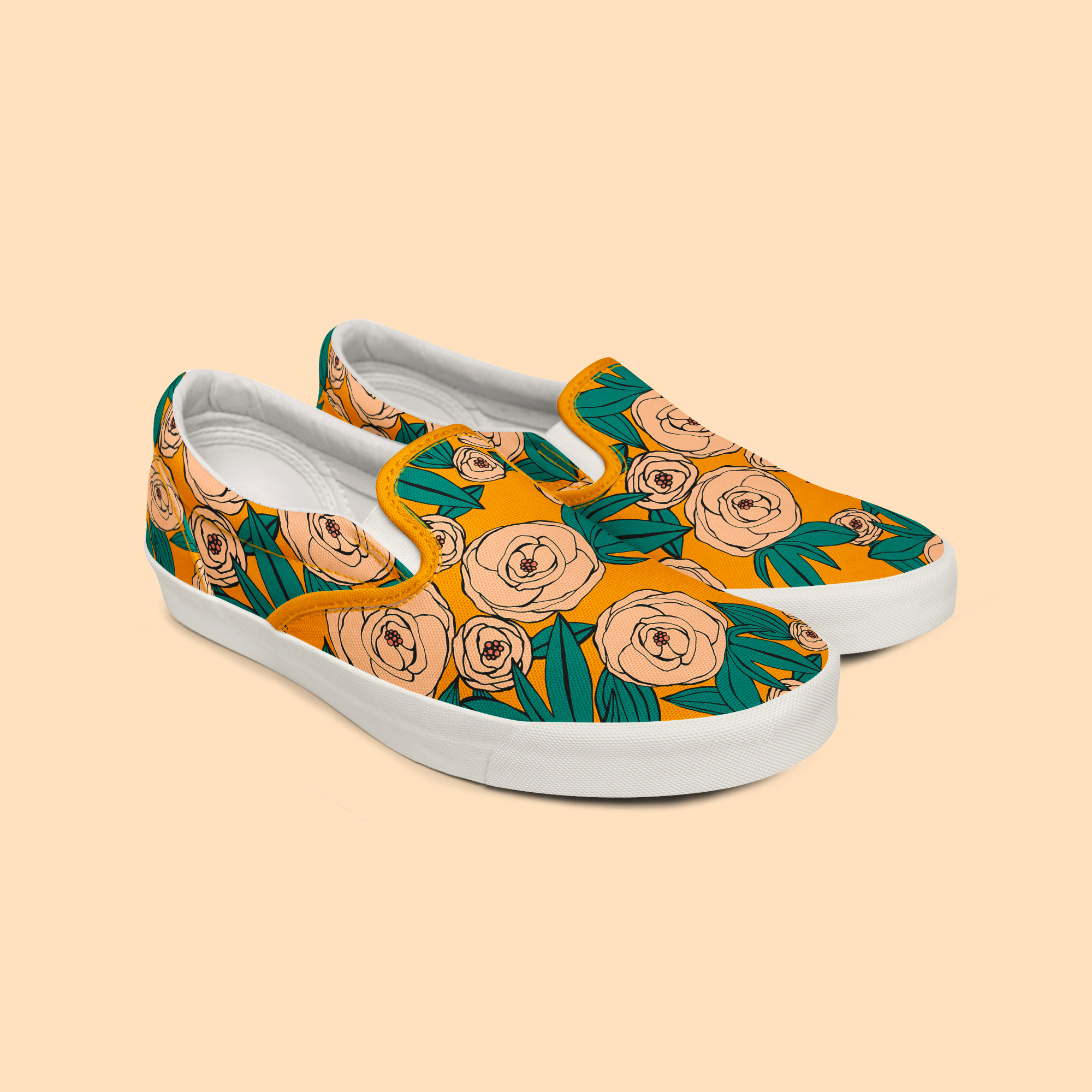 Pair of sneakers with floral pattern on a beige background.