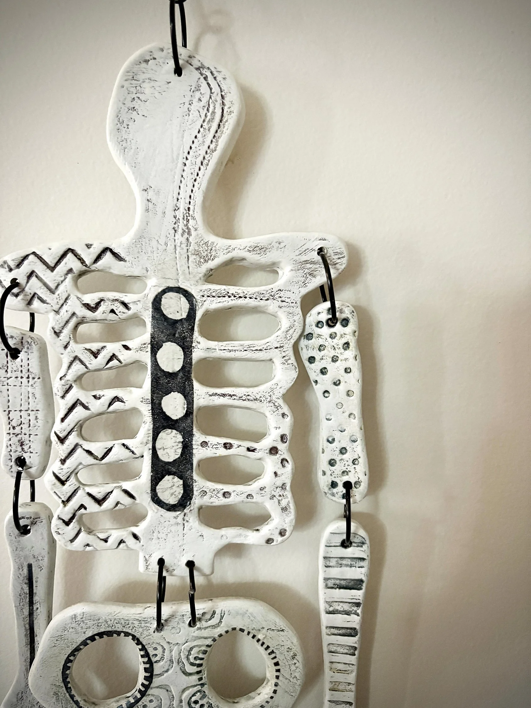 DANCING BONES   |   paper clay, acrylic, collage   |   20" x 7"