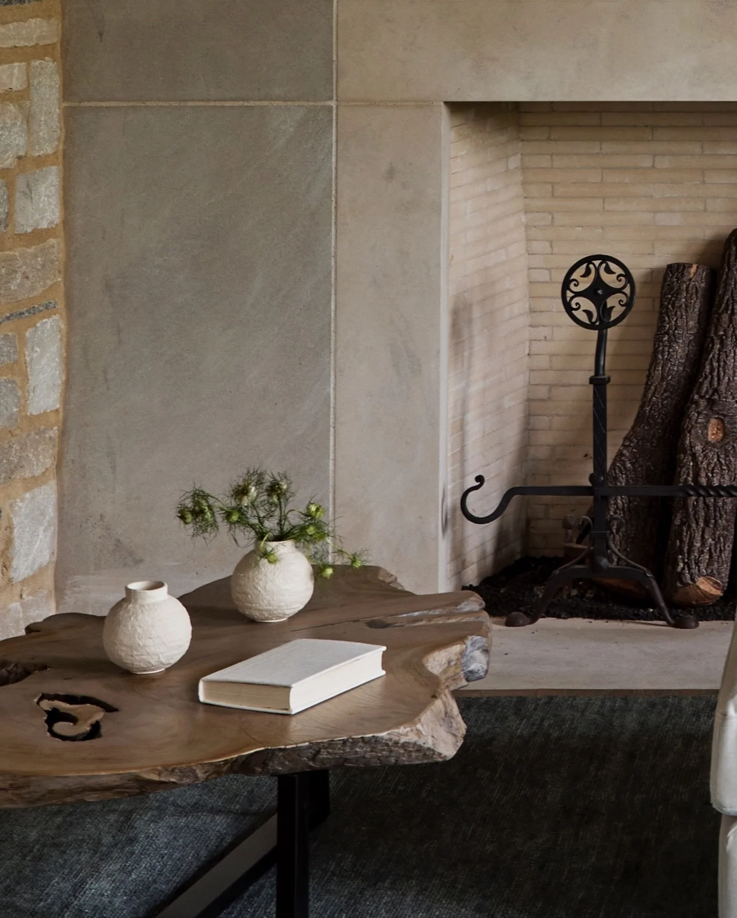 Bringing the exterior stone inside will always be a yes from us.

It instantly grounds the space and keeps the whole house connected.

Now, who&rsquo;s ready to sink into that chaise and read by the fire?

Architecture: @michael_abraham_architecture
