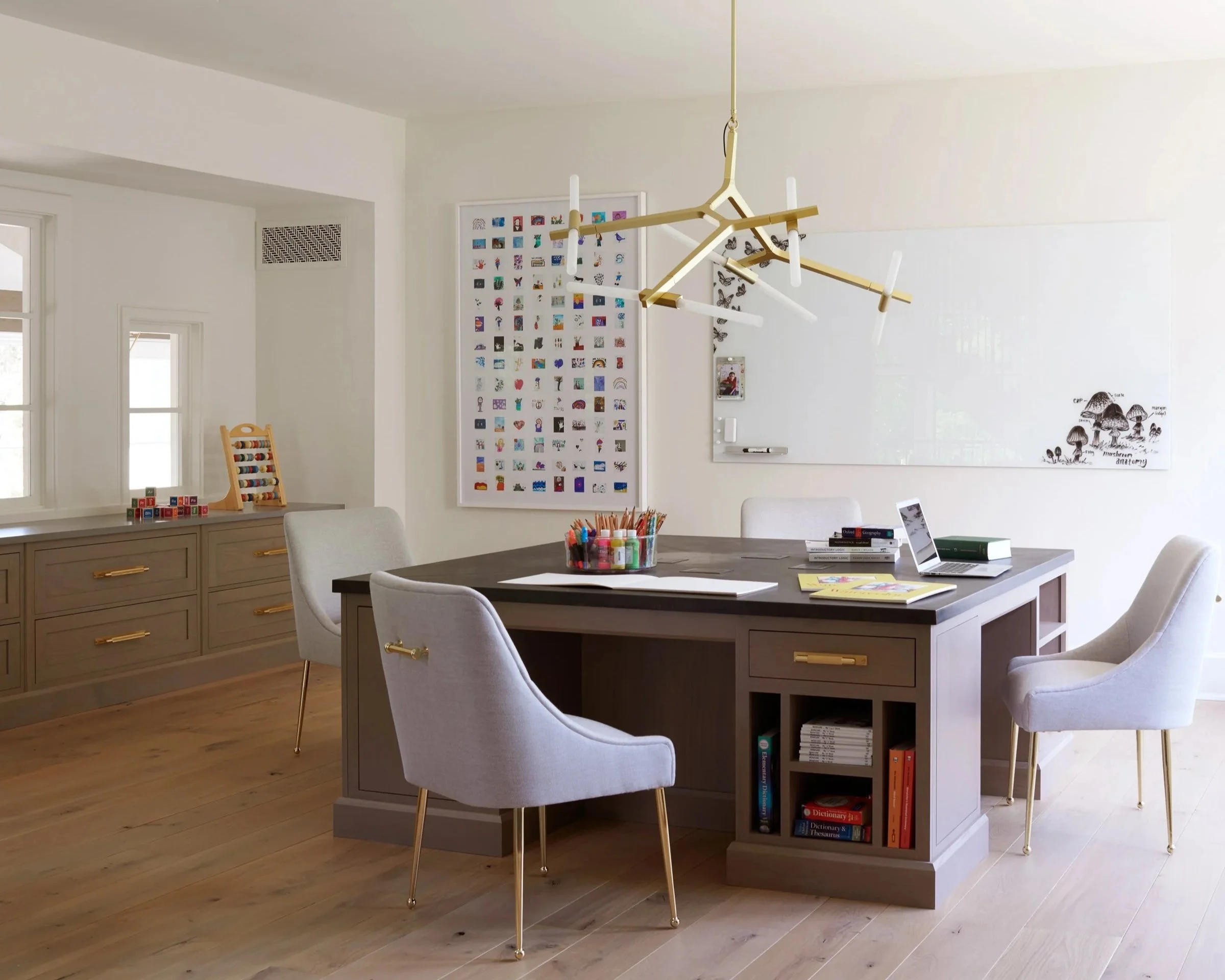 Family study space with children’s artwork displayed as statement piece.