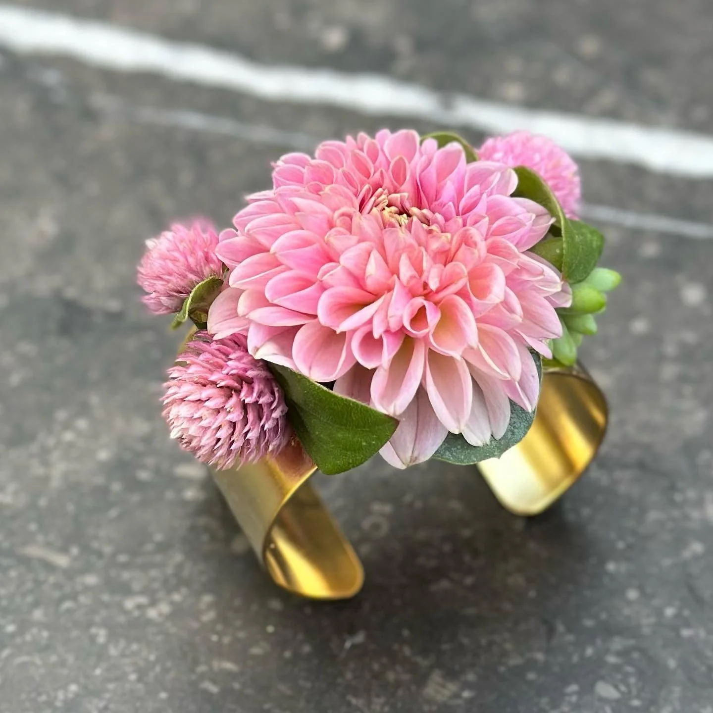 Floral Brass Cuff with dahlia, gomphrena, and a succulent.
